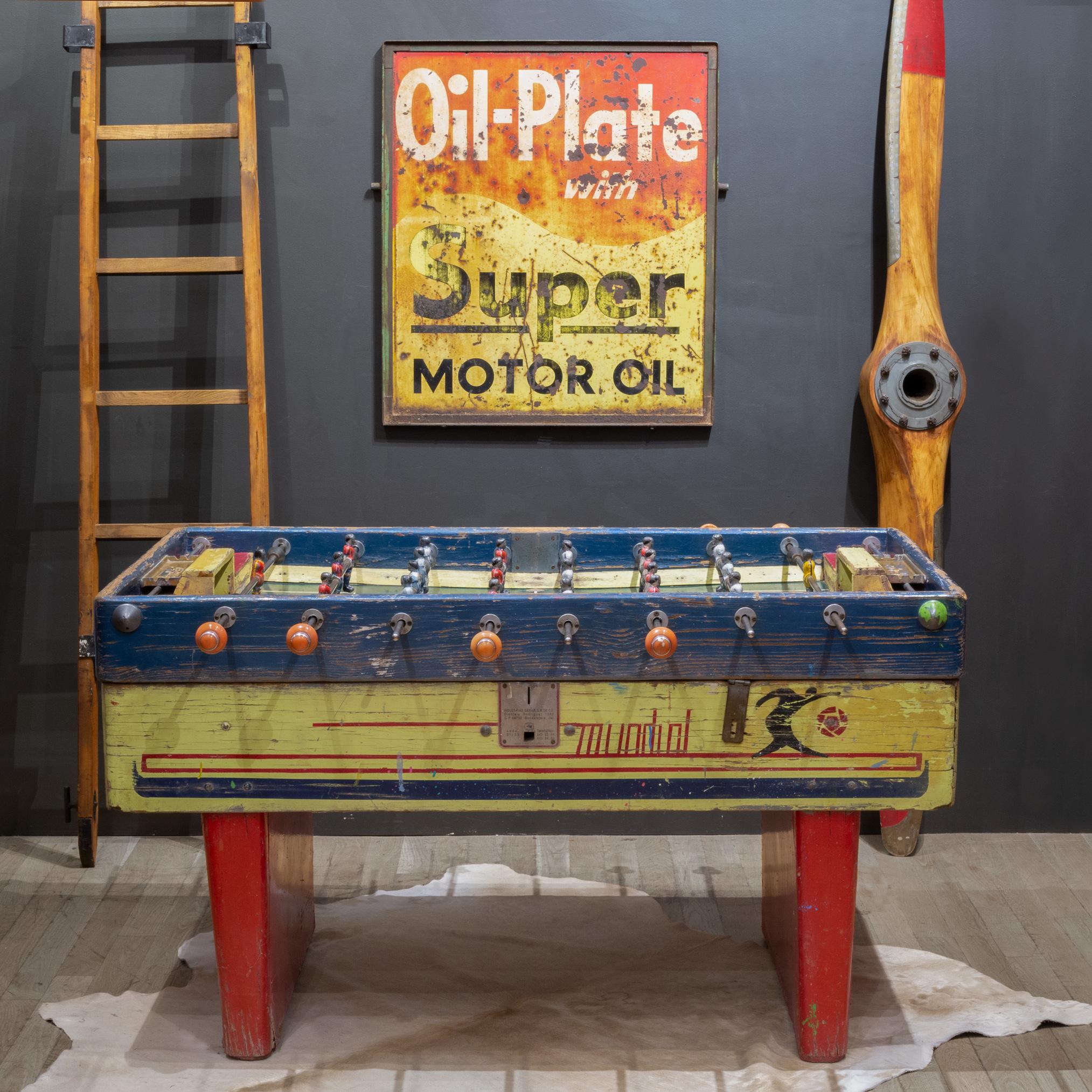 ABOUT

An early 20th c. wooden foosball table top with distressed, painted metal Mexican soccer players, rubber handles and metal 