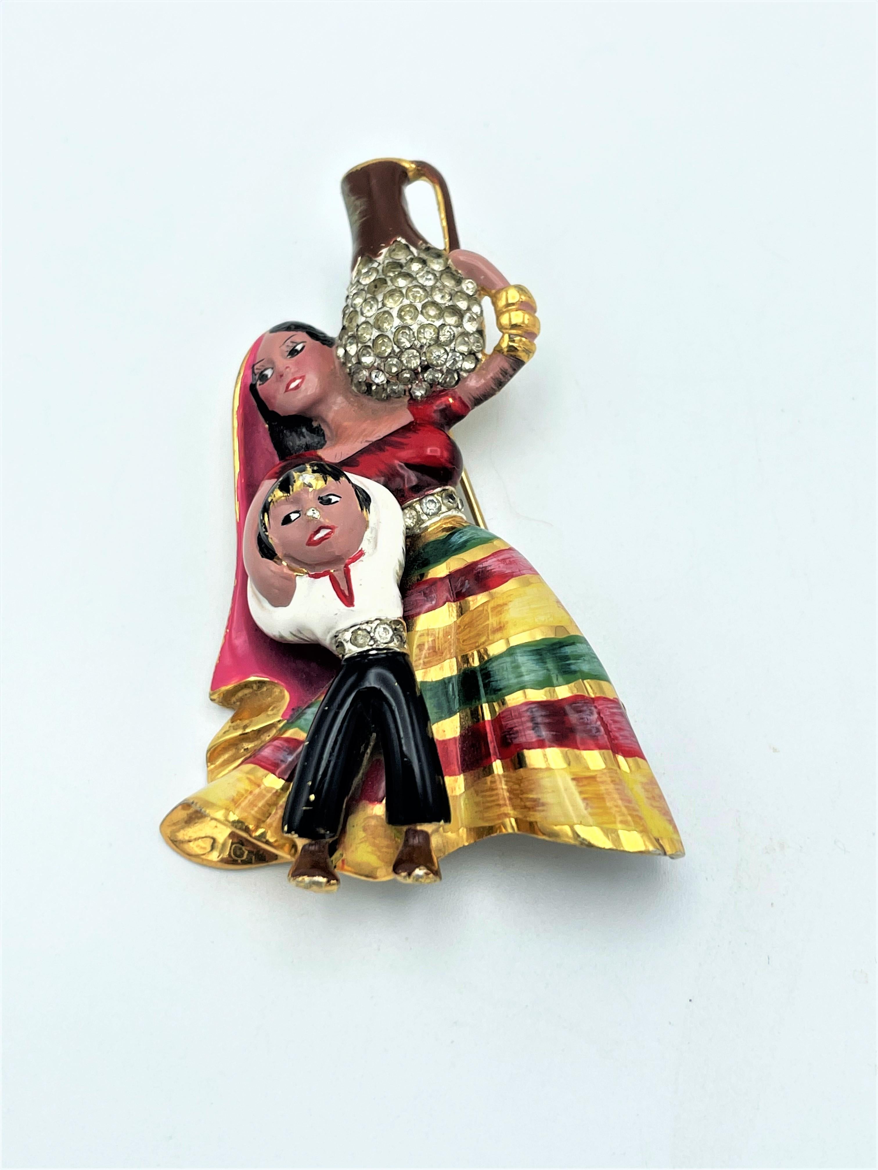 About
Gold Pave and enamel Mexican Lady with a boy child carrying a water jar brooch. 
Measurements:
Height: 2,65 inches (6,75 cm)
Width:   1,7    inches (4,32 cm)
Deep:    0,67 inches (1,7 cm)
Features:
- 100 % authentic Coro Craft 
- Designer