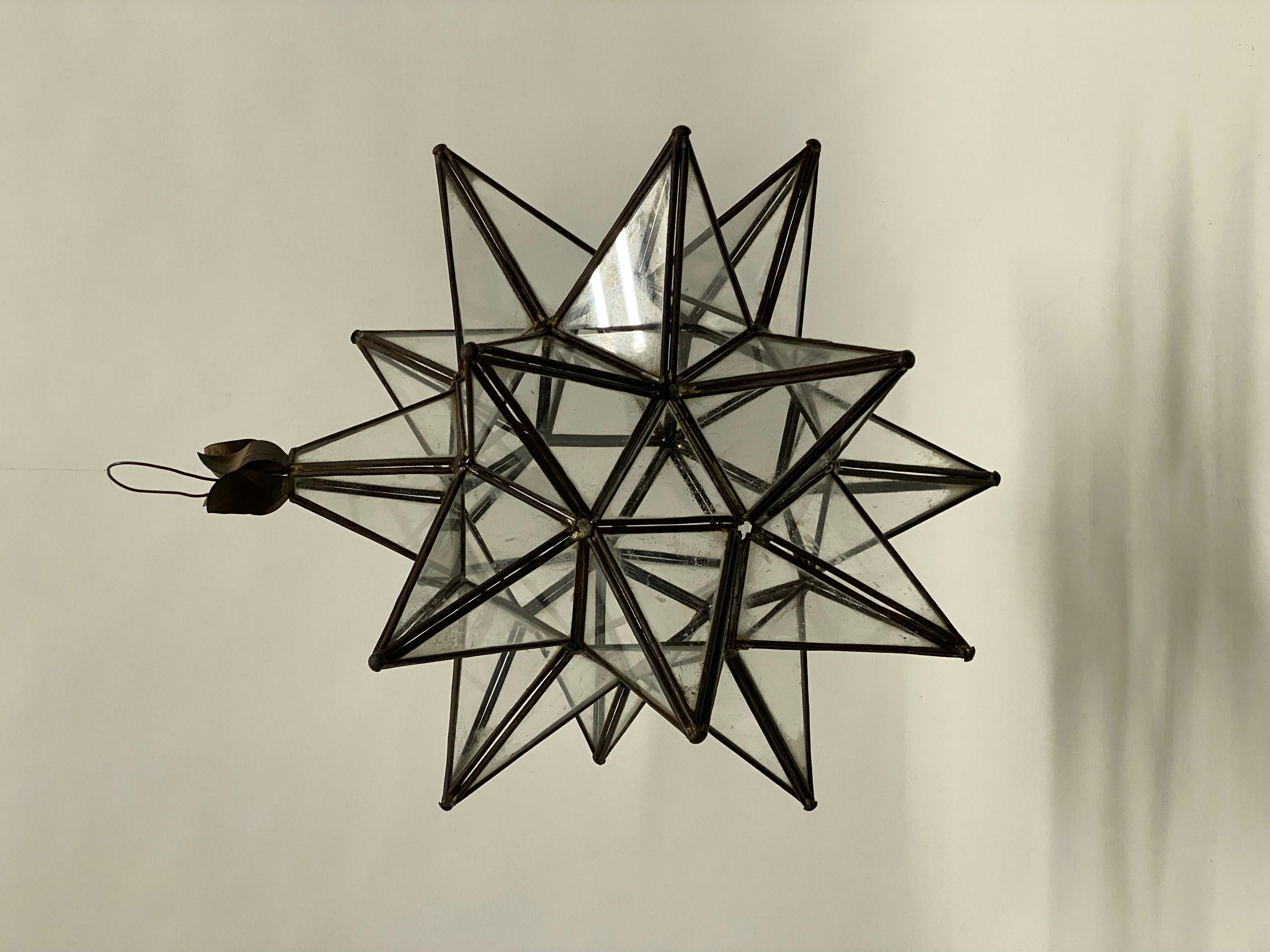 Beautiful leaded glass panel Moravian Star hanging fixture. Circa 1960. Most likely originates from Mexico. The Moravian Star has deep spiritual meaning. Some Moravian Stars have 26 points and some have 20 points, as well as 100 points. There is a