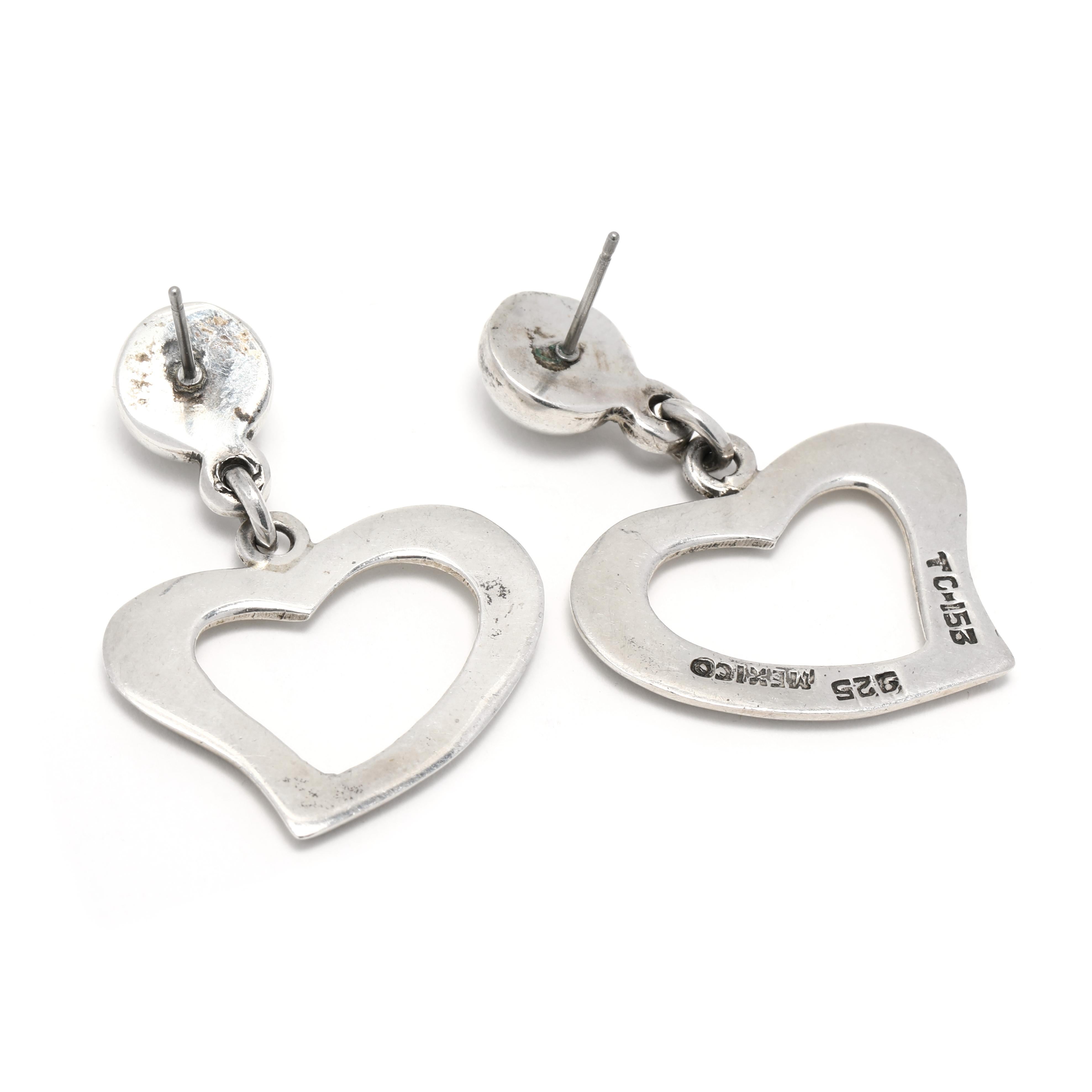 These unique Vintage Mexican Open Heart Dangle Earrings are handcrafted from Sterling Silver and measure 1.5 inches long. The large heart earrings feature a stunning open heart design, perfect for a special occasion or everyday wear. The lightweight