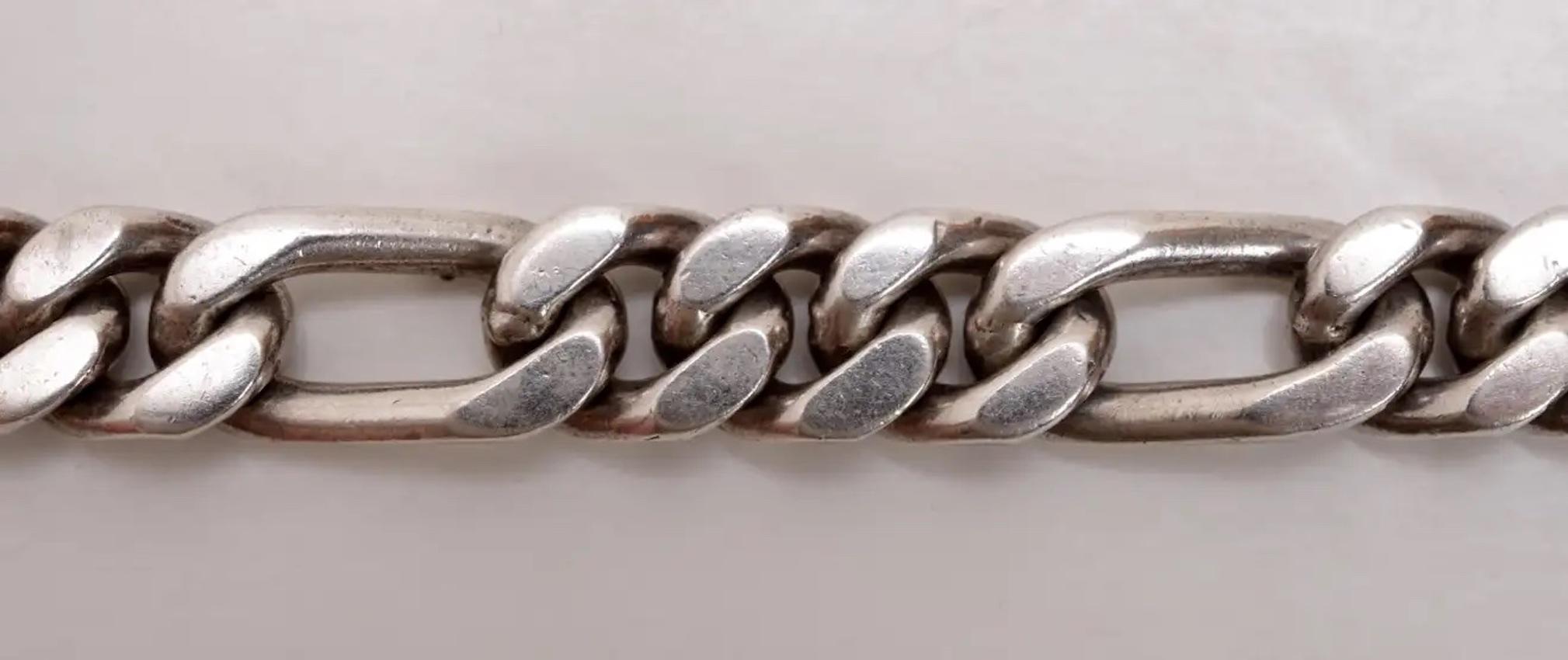 Vintage Mexican Sterling Silver (.925) Heavy, Large Figaro Link Bracelet From Taxco, Marked Mexico .925, ID-17. With double locking clasp.
Trent Antiques has been a respected name in antiques for over 30 years with a large collection of period