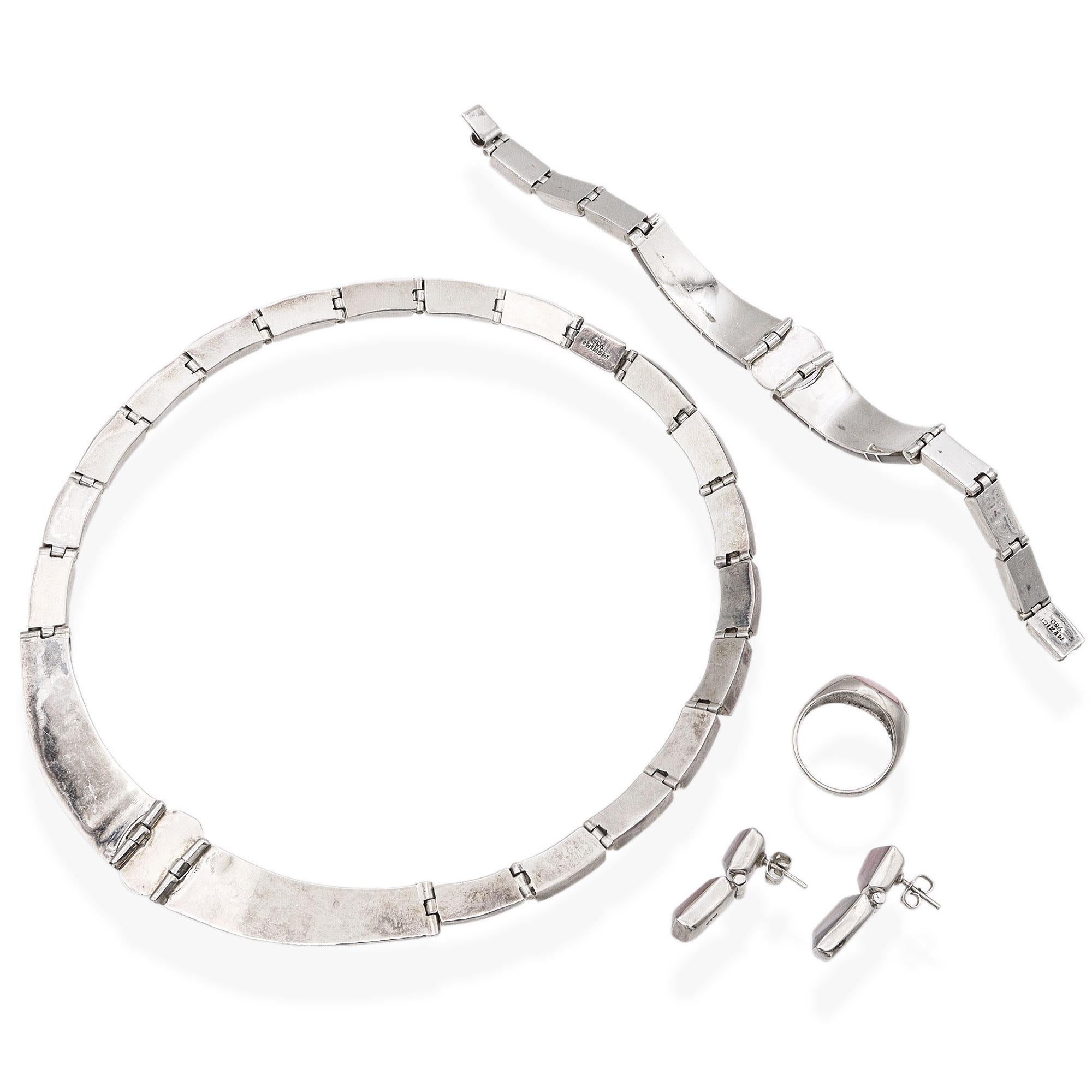 Elegant and beautifully coordinated, this stunning four-piece jewelry set features soft pink mother of pearl inlay set in gleaming sterling silver. The set includes a necklace, bracelet, pair of earrings, and a matching ring—all showcasing a