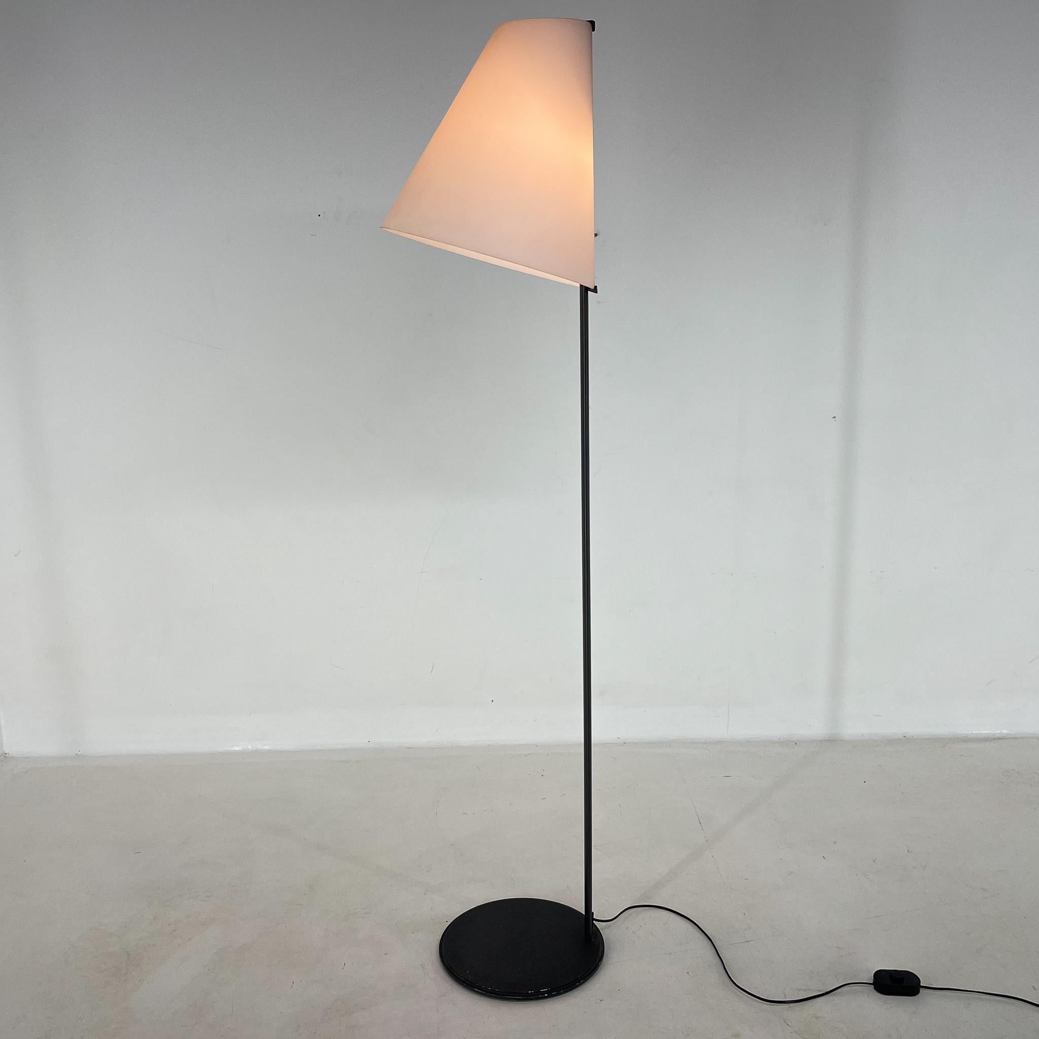 This beatiful lamp was designed by the founders of Leucos Renato Toso and Giovanna Noti Massari in Italy in the 1980's. The lamp has black metal base and the lamp shade is made of white opaline glass with a slight pink tinge.