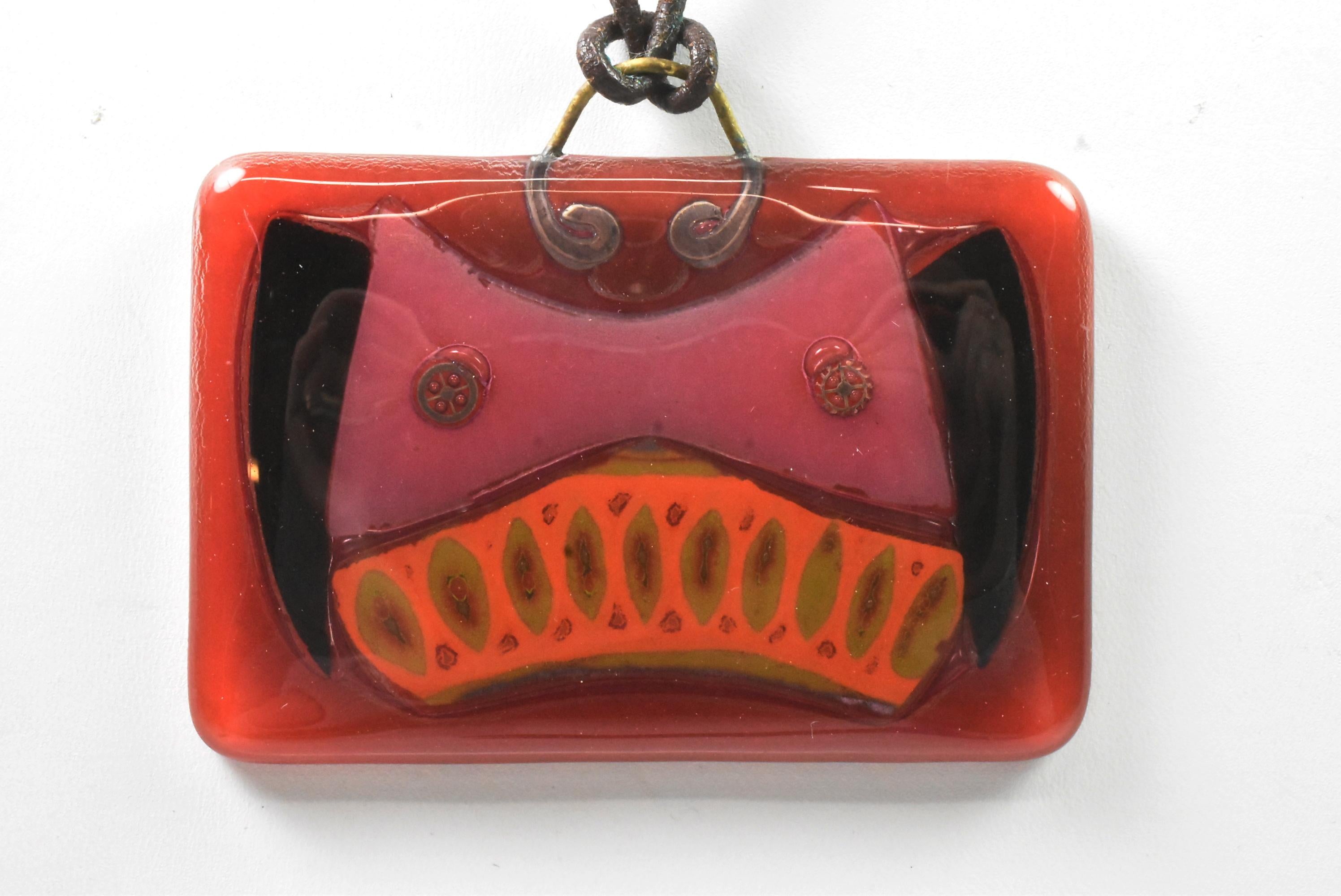 Vintage Michael and Frances Higgins American Modernist Fused Glass Pendant. Vintage 1960s handmade glass pendant of ruby red with black, pink, orange and gold. Signed on back. Great condition, no chips or scratches. 23