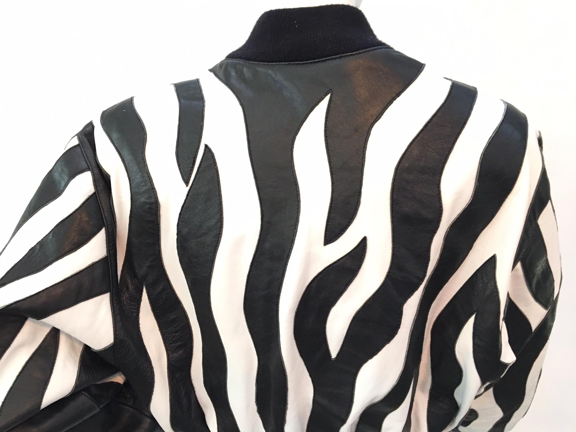 Vintage leather bomber jacket designed by Michael Hoban for North Beach Leather.  Classic 1980s black and white zebra design.  Zipper front closure.  Excellent condition, leather is soft and supple.  Elastic knit cotton cuffs, waist, and collar. 
