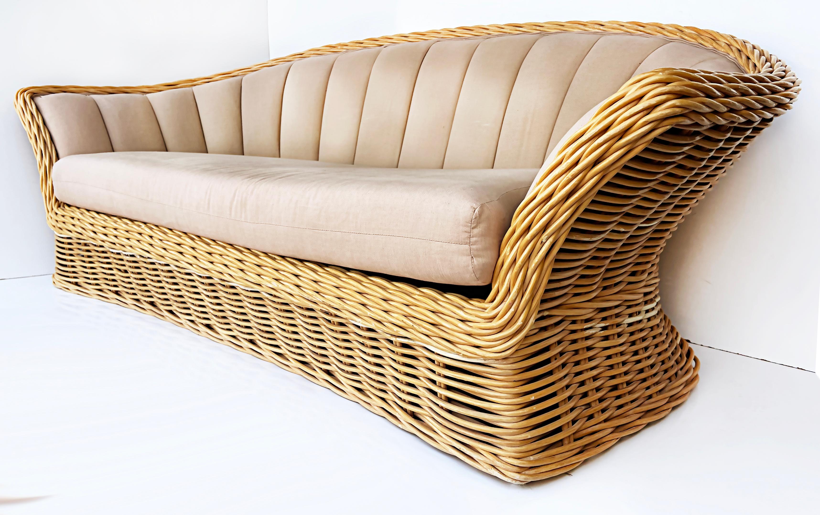 Vintage Michael Taylor style woven rattan channel sofa

Offered for sale is a vintage Michael Taylor-style sofa created with woven rattan. The sofa is upholstered with a channel back. The frame is well-made and quite sturdy.

Dimensions: Height: