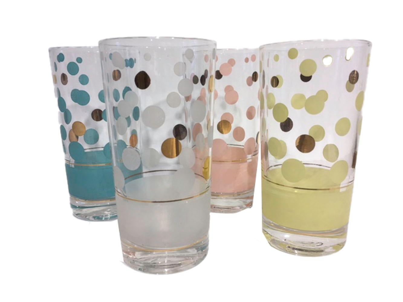 Vintage set of 8 highball glasses designed by Fred Press. Two each of four colors, pink, aqua, white and yellow. Each glass has a band of color at the base with dots of various sizes above a gold line, the dots are in the same color as the band as