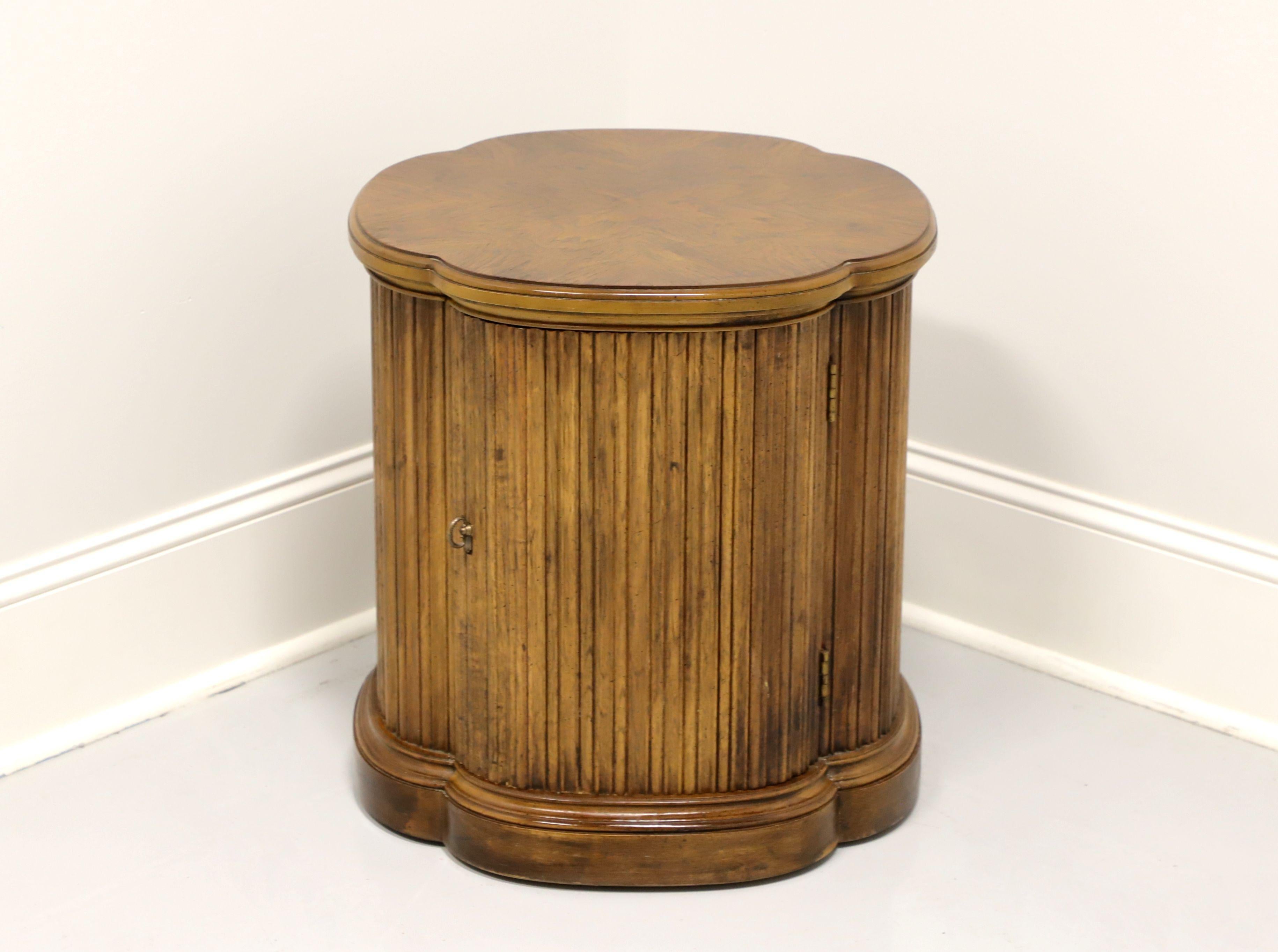 A Transitional style clover shaped cabinet accent table by Henredon. Burl walnut with brass pull. Features unique four leaf clover shape and ample storage within cabinet. Made in North Carolina, USA, in the mid 20th Century. 

Measures: 20.25W