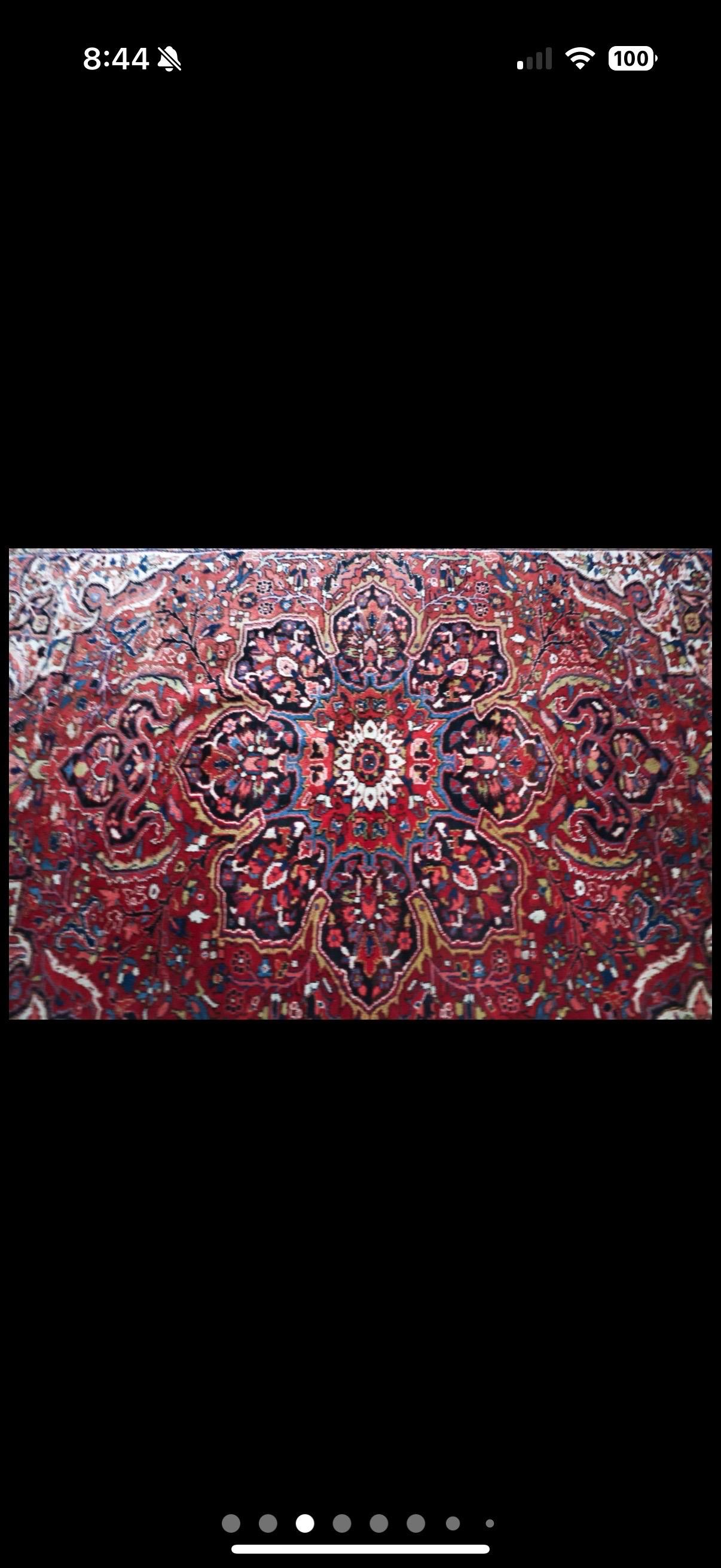 A stunning vintage Persian Heriz rug with Mid-Century Modern style measuring 137 inches long. Warm luxurious Mid-Century Modern style, this hand-knotted wool vintage Persian Heriz rug features a geometric medallions around center. A variety of