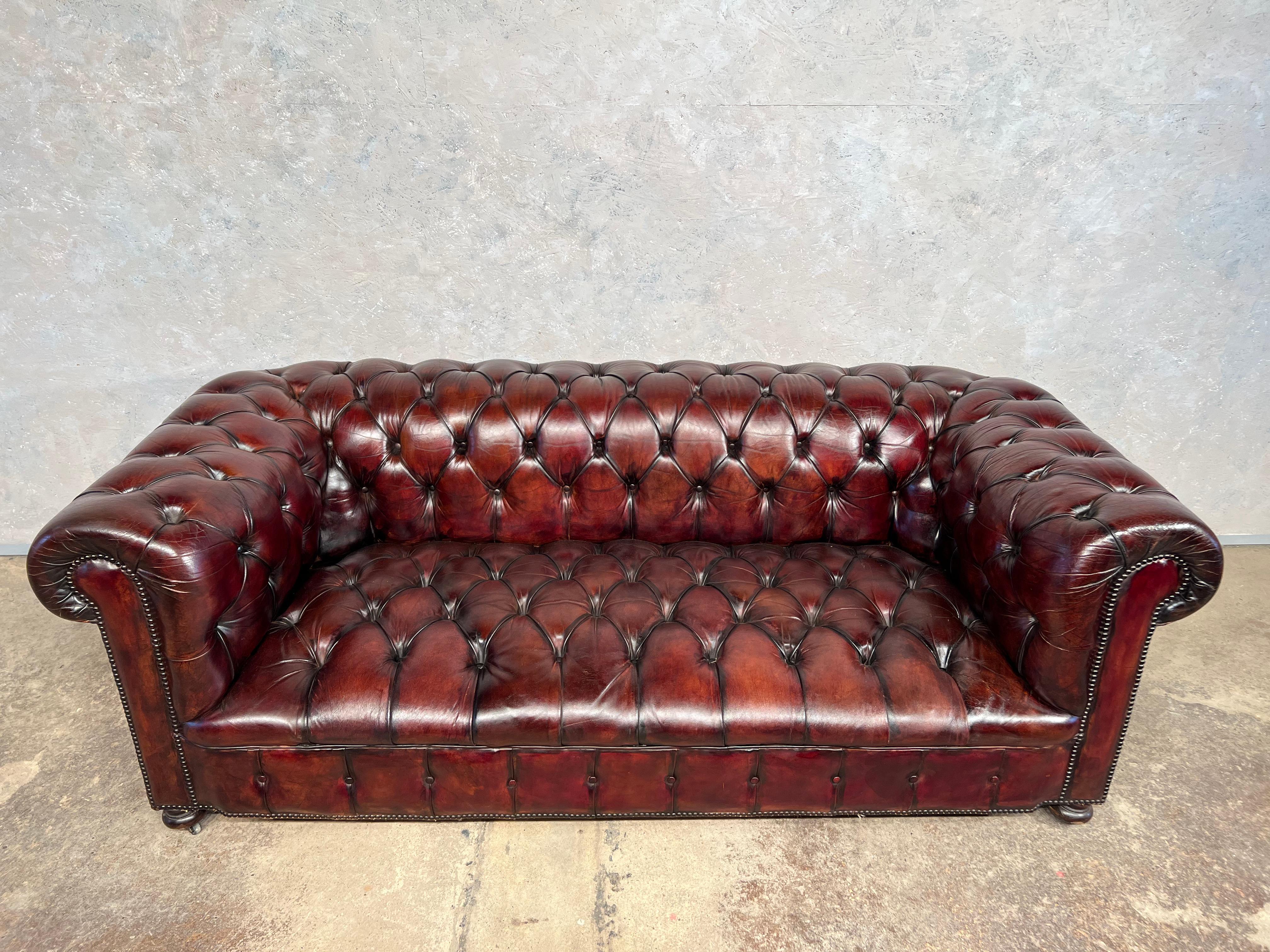 Antique fully buttoned patinated chestnut brown leather chesterfield with horse hair filling.

A most beautiful item, circa 1920 with it’s original leather, which has a Patinated finish, fully coil sprung.

Viewing is welcome at our showroom in