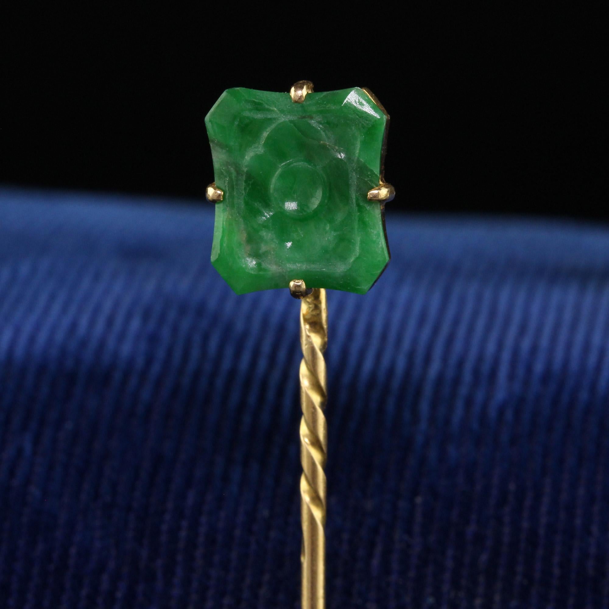 Beautiful Vintage Mid Century 18K Yellow Gold Carved Jade Floral Stick Pin. This beautiful stick pin is crafted in 18k yellow gold. The pin holds a beautiful carved natural jade that has a flower design on it. The stick pin is in good condition and