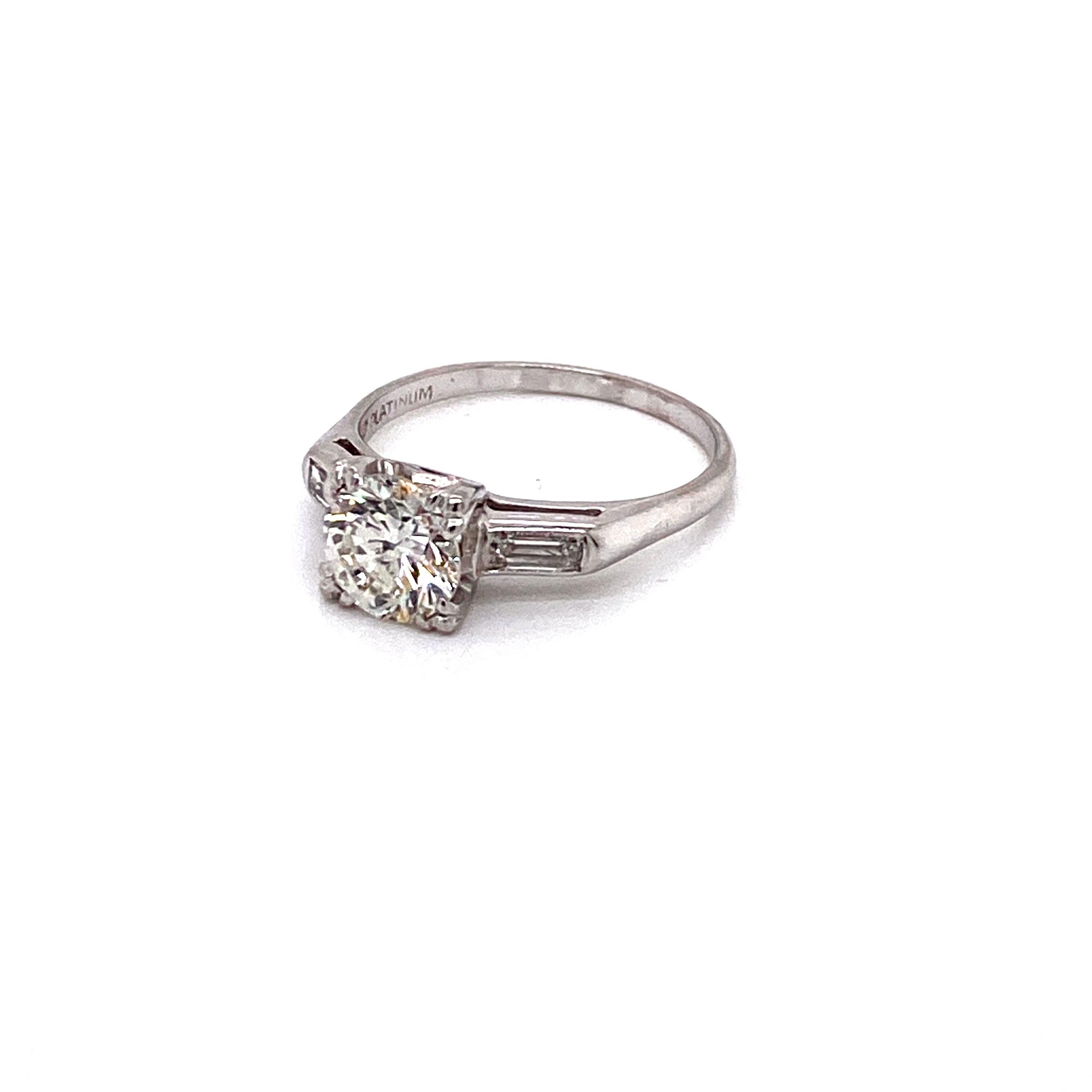 Round Cut Vintage Midcentury 1950s 1.15 Carat Round Diamond and Baguette Platinum Ring For Sale