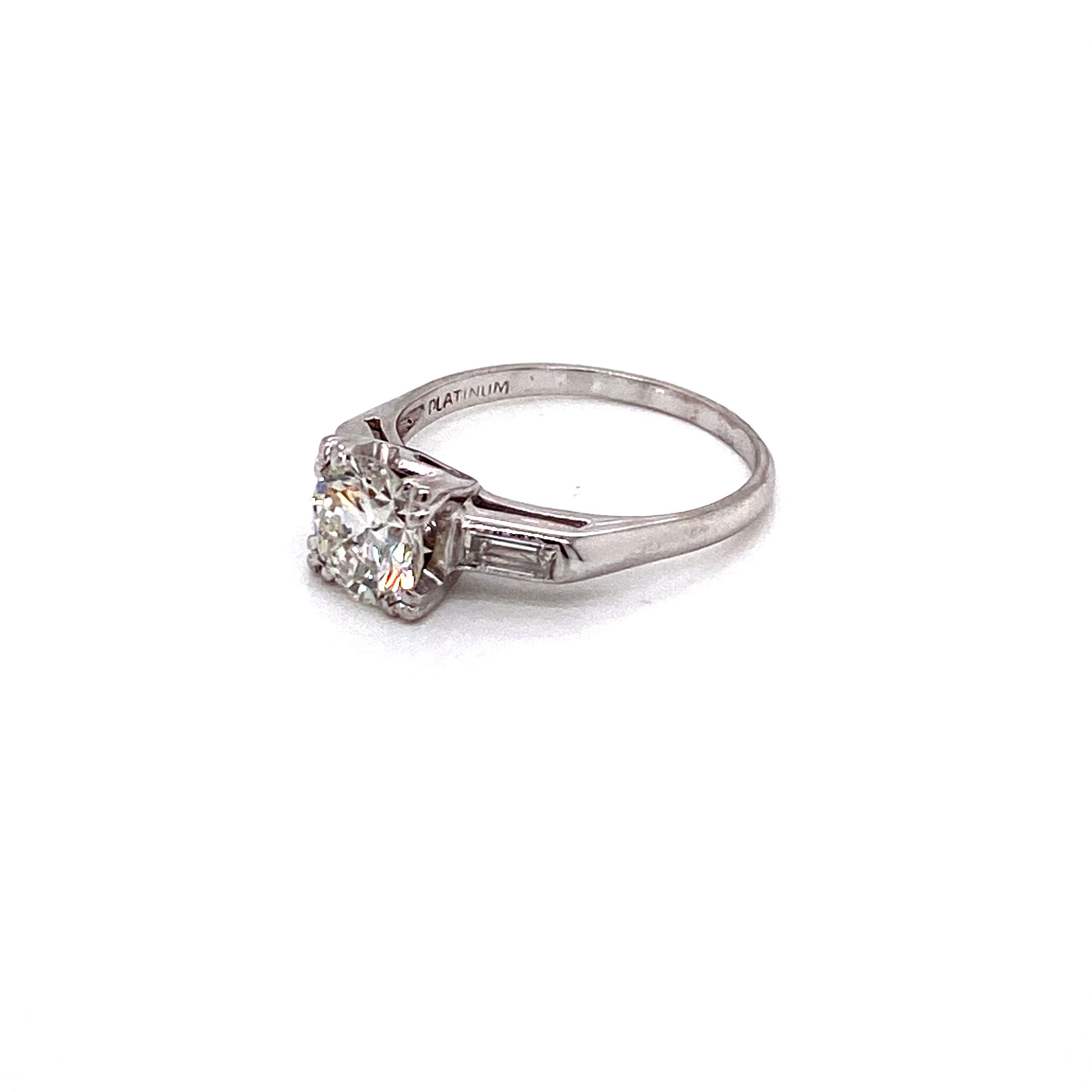 Vintage Midcentury 1950s 1.15 Carat Round Diamond and Baguette Platinum Ring In Good Condition For Sale In Boston, MA
