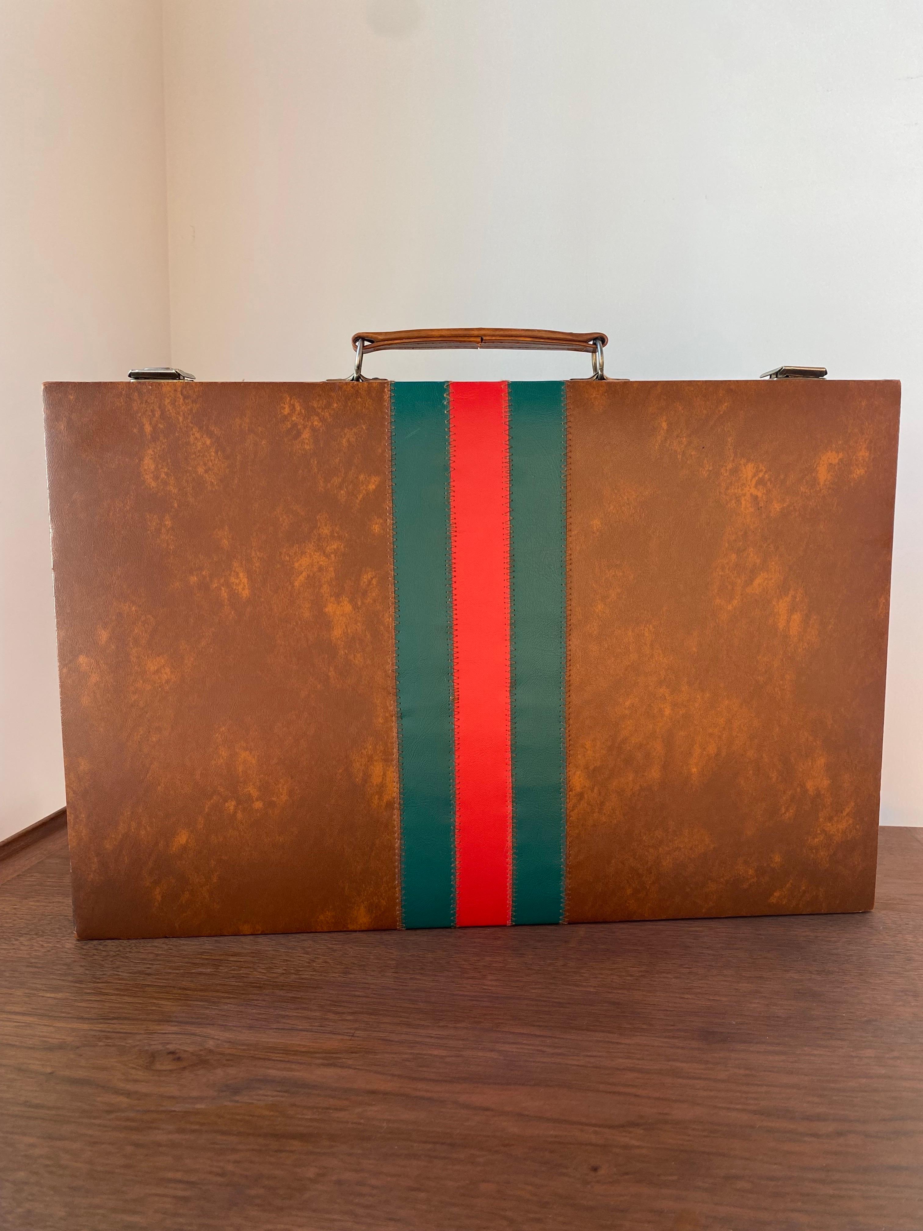 Vintage 1960s backgammon set. Enveloped in a pleather with  signature gucci style lines, this piece is reminiscent of Gucci with its designer lines and high end stance. The discreet, classic colors with distinct and interesting designer pattern in