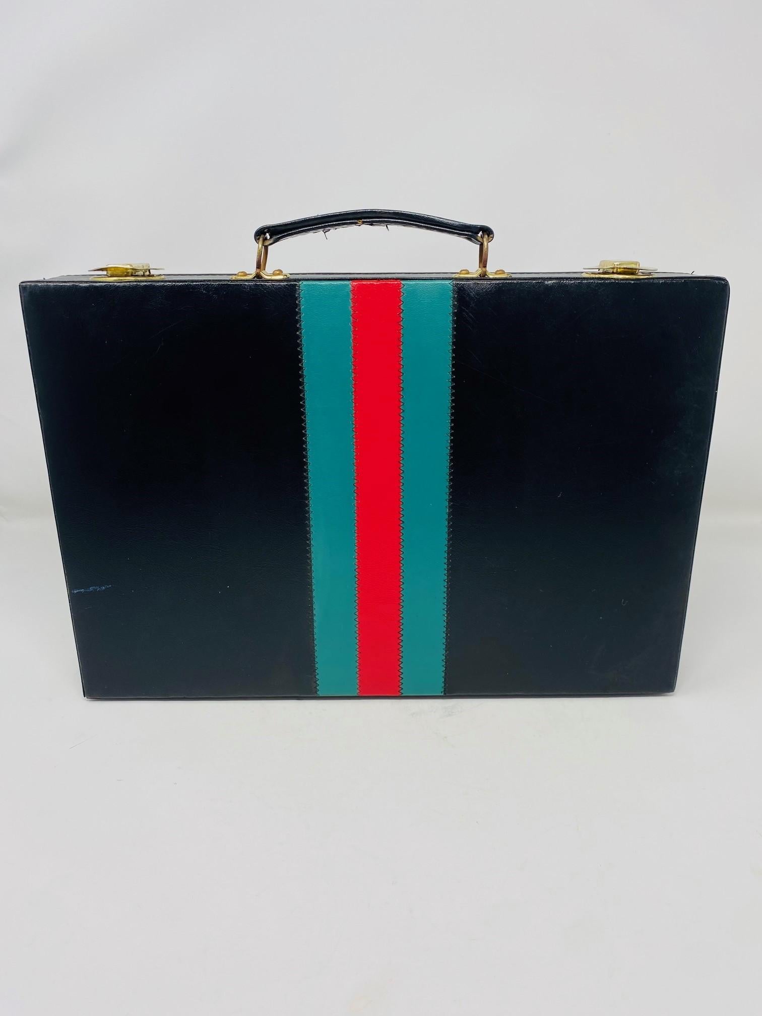 Vintage 1960s backgammon set. Enveloped in a pleather with  signature gucci style lines, this piece is reminiscent of Gucci with its designer lines and high end stance. The discreet, classic colors with distinct and interesting designer pattern in