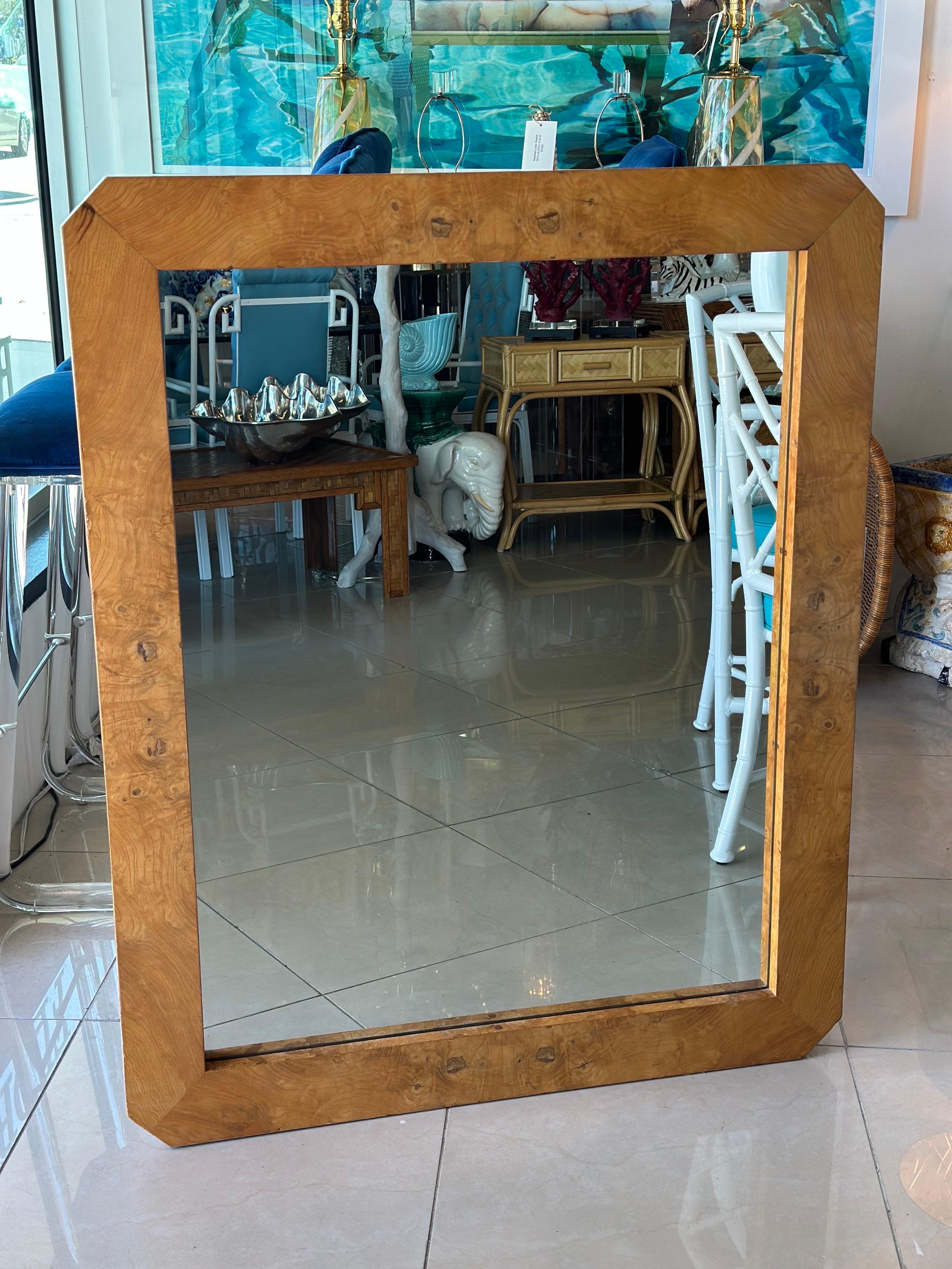 Vintage burl wood burl wood Milo Baughman style wall mirror. Comes ready to hang. Dimensions: 43.5 H x 35.5 W x 1.5 D.