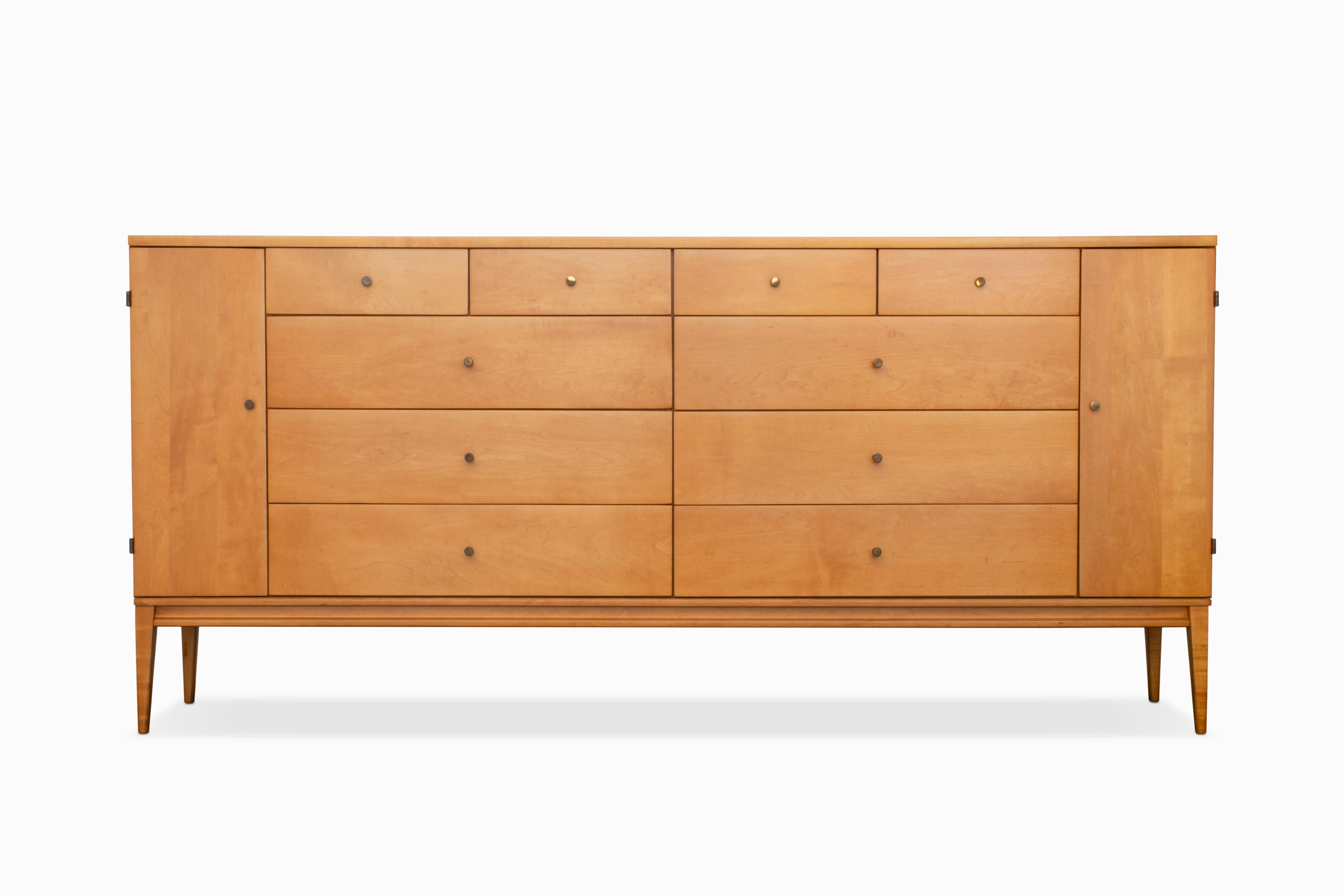 Here is a beautiful 20-drawer, solid maple dresser designed by Paul McCobb for Winchendon Furniture Company. This highly sought after 