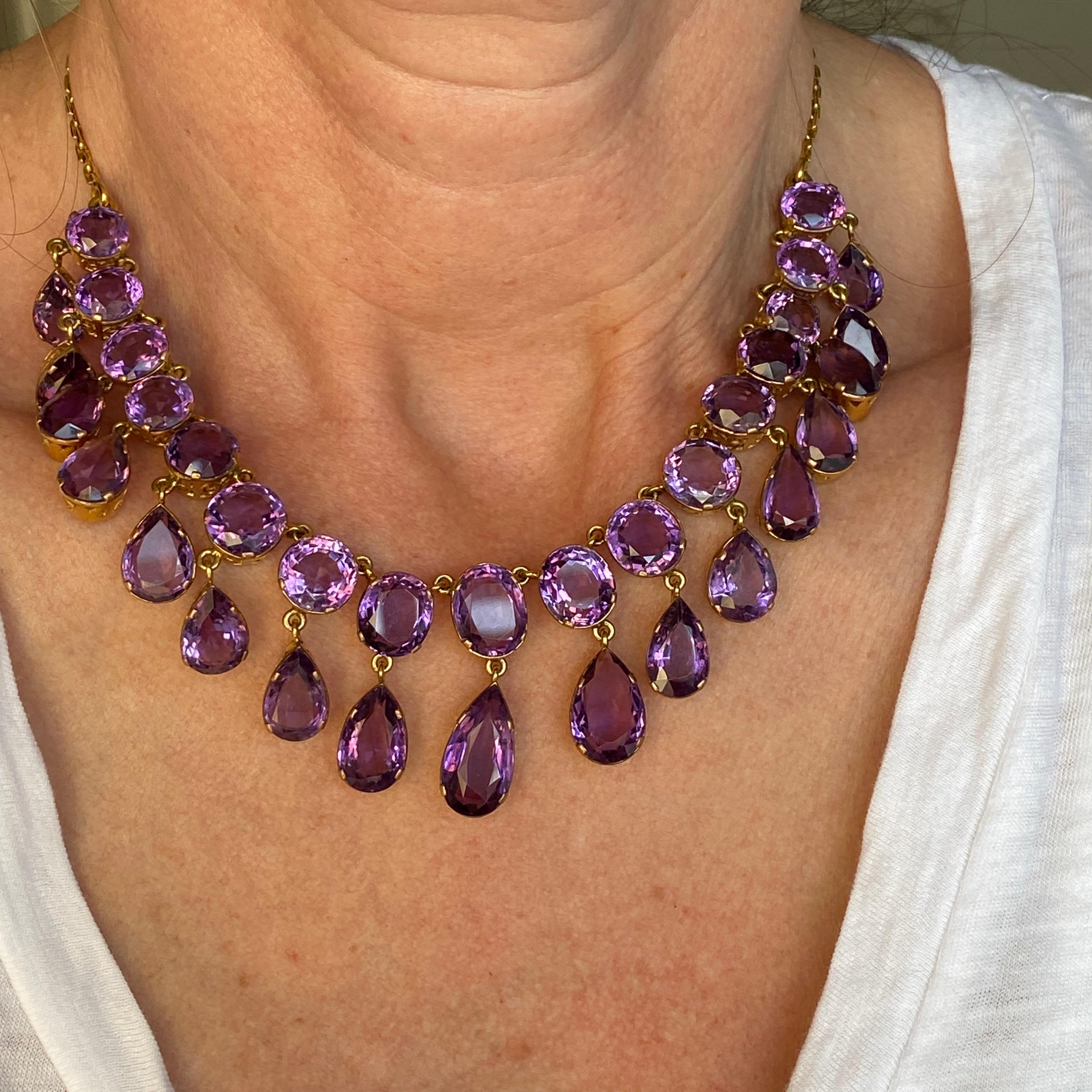 Details:
Stunning Mid Century Amethyst and 14K gold necklace. This gorgeous piece begs to be worn to a grand ball or the Met Gala! Simply stunning! 53 carats of gorgeous amethysts, with lovely color saturation, this necklace is a show stopper! The