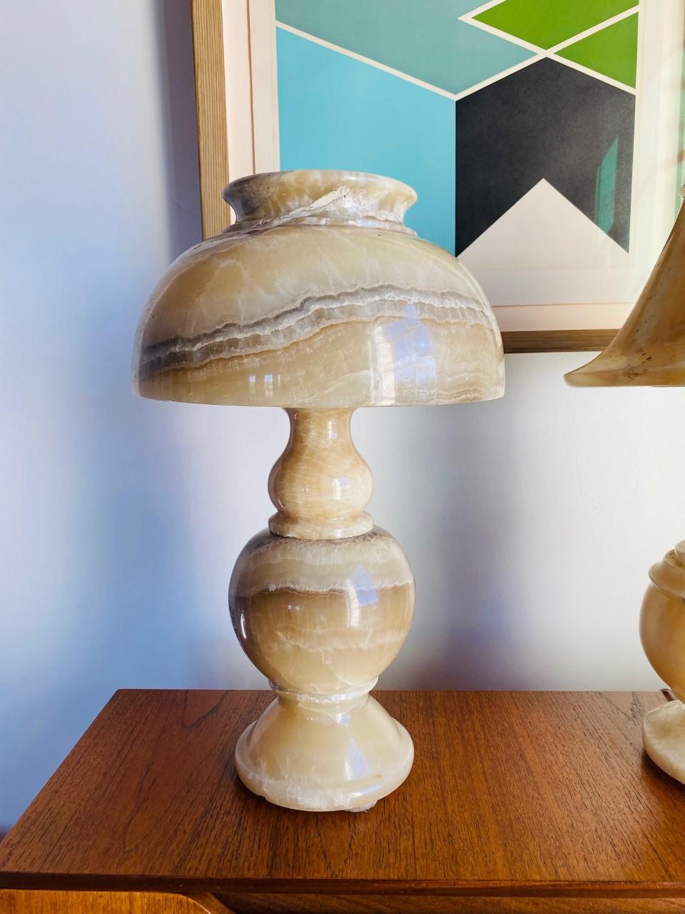 Beautifully carved alabaster marble lamp that is striking and beautiful. This lamp is composed of a marble body and a marble shade and together stand not only as a lamp, but as a sculpture. The classic shapes against the translucent alabaster give