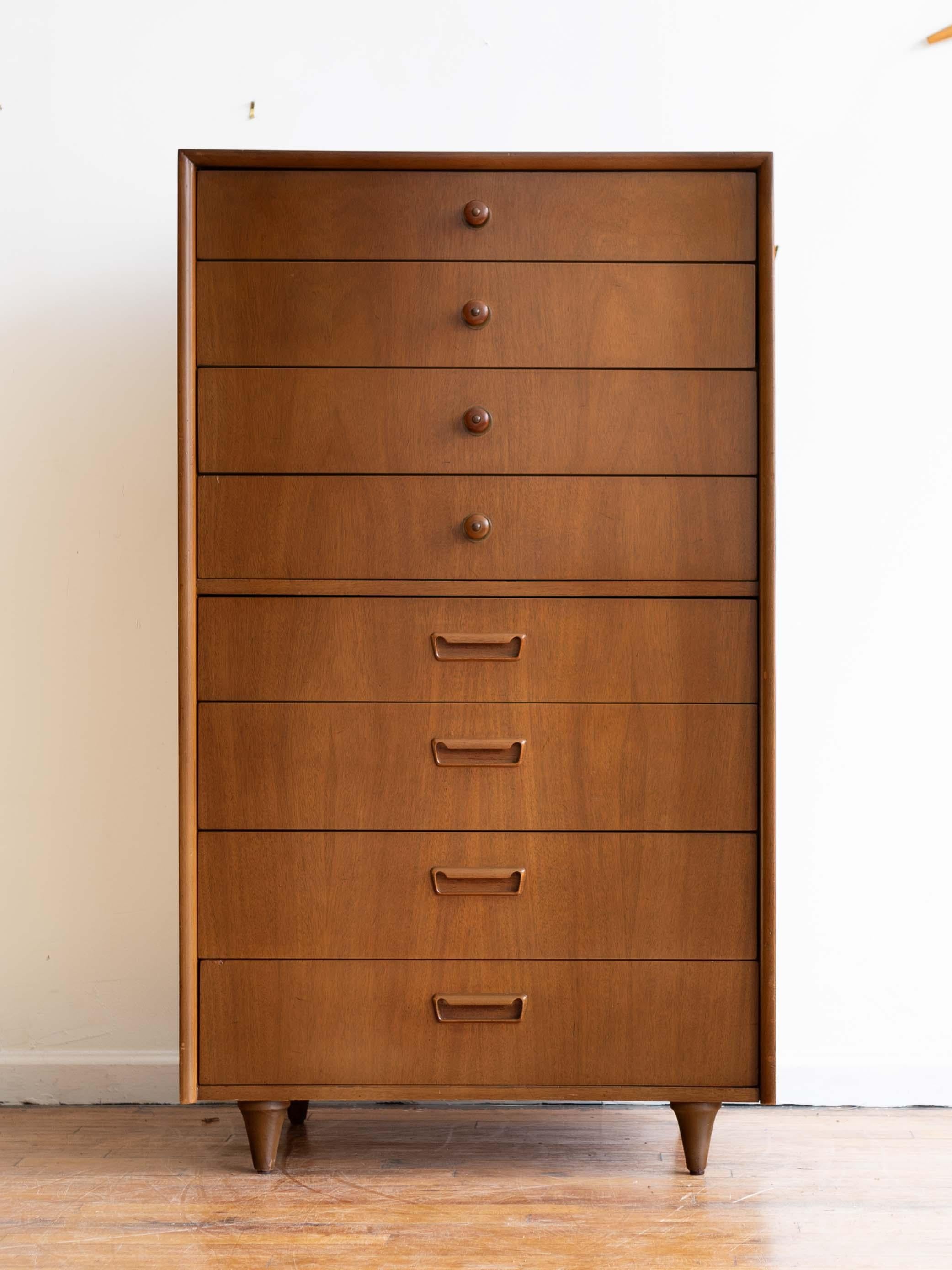 30” x 18.5” x 52”H

Highboy lingerie chest in walnut from American of Martinsville with eight dovetailed drawers and rounded mitered face frame. Wood and brass pulls on the top; inset Danish-style pulls on the bottom half.

Very good vintage