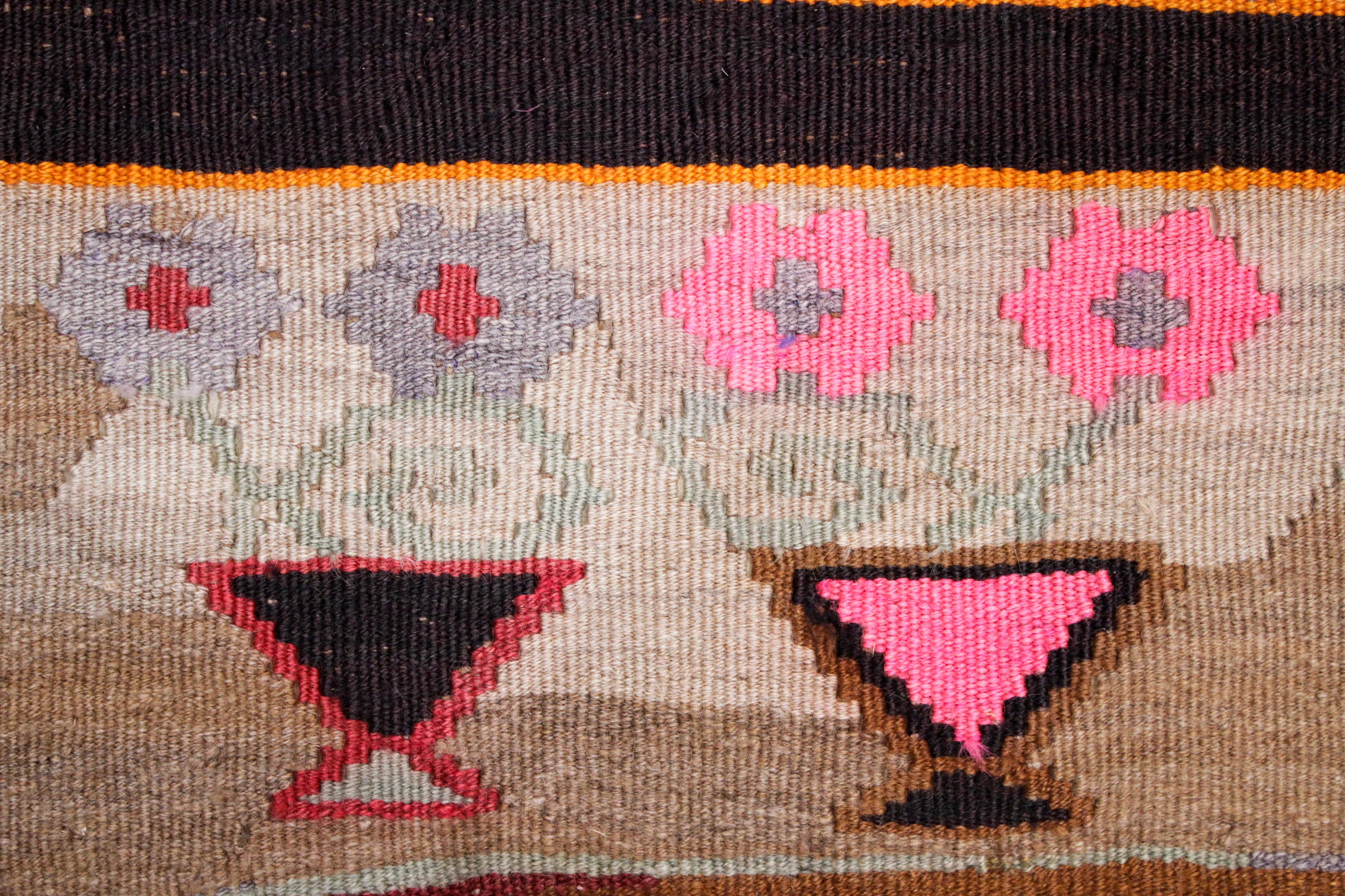 An iconic example of flat-woven wool kilim originating from Kars, located in eastern Anatolia close to the border with the Caucasus. The kilims from this region are renown for their sturdiness, as well as for their bold patterns which are taken from