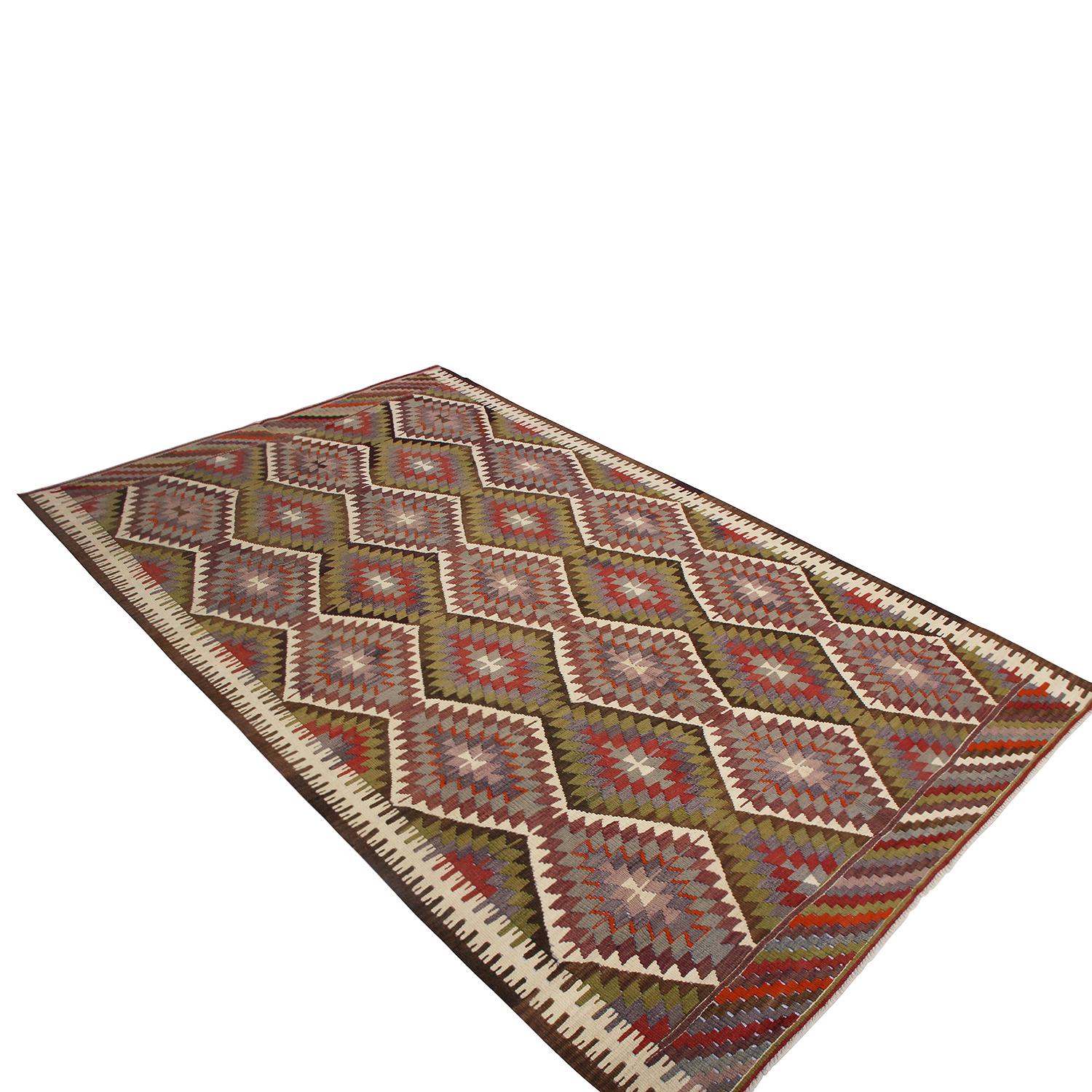 Flat-woven in Turkey originating between 1950-1960, this vintage midcentury wool Kilim hails from the city of Antalya, hosting one of the more uncommon, individualistic arrays of colorways among its era balancing an accenting presence of rich red