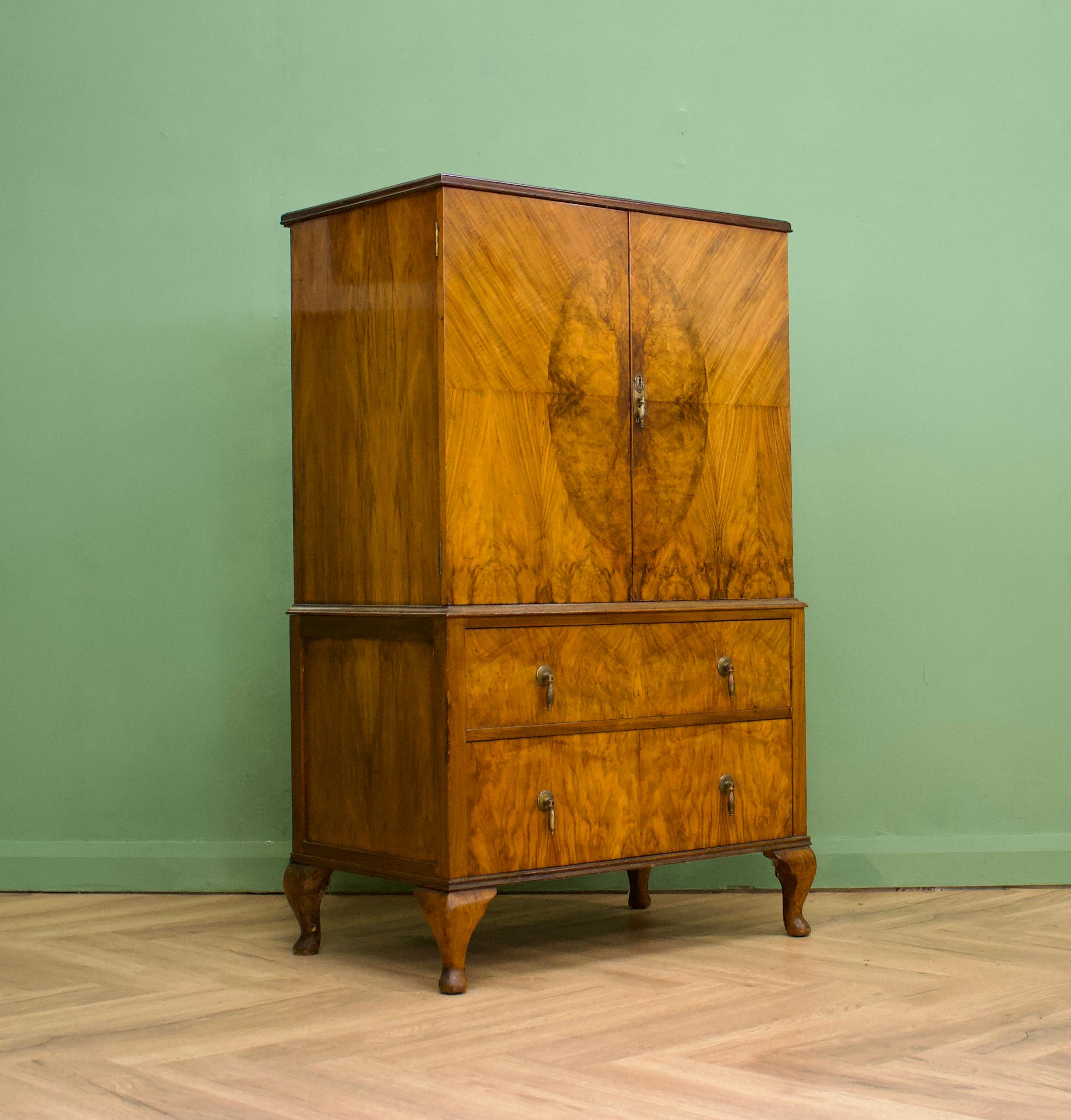 An impressive quality, 1930's style burr walnut linen cabinet - perfect for a maximalist interior - circa 1950s-1960s
The walnut veneers have been beautifully quarter matched on the doors and inlaid
 
The interior of the top cupboard is fitted out