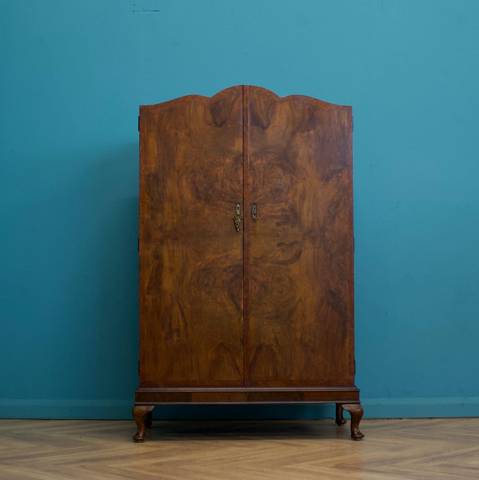 An impressive quality Art Deco walnut tallboy or housekeeper’s cupboard

circa 1930s

Standing on Queen Anne style feet


Internally there's a shelf and three drawers