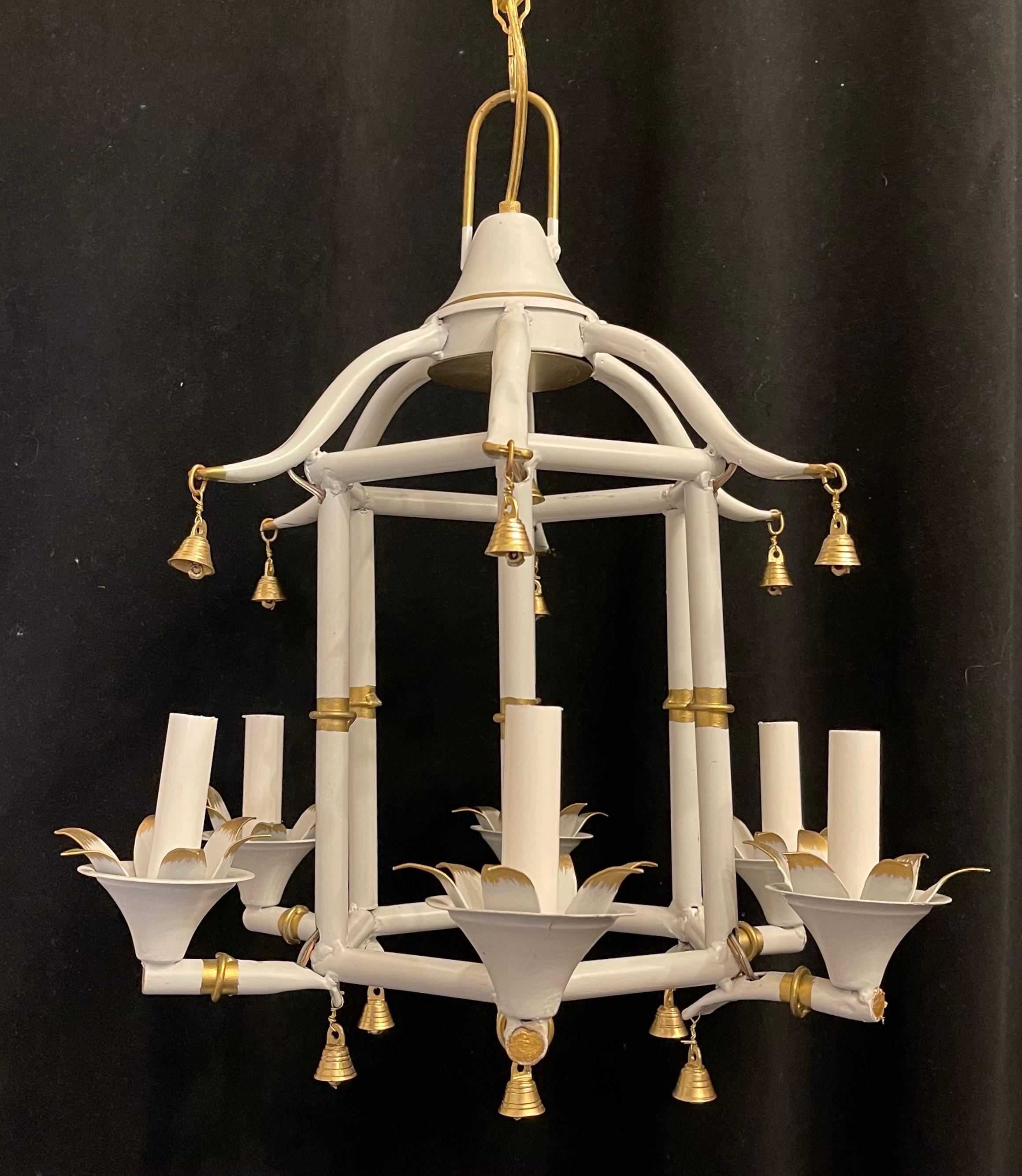 A Wonderful Vintage Mid-Century Bagues / Jansen Style, Pagoda Tole White With Gold Gilt Bamboo Form Chinoiserie Chandelier With 6 Candelabra Lights And Decorated With Bells.
Rewired And Ready To Install With Chain Canopy And Mounting Hardware