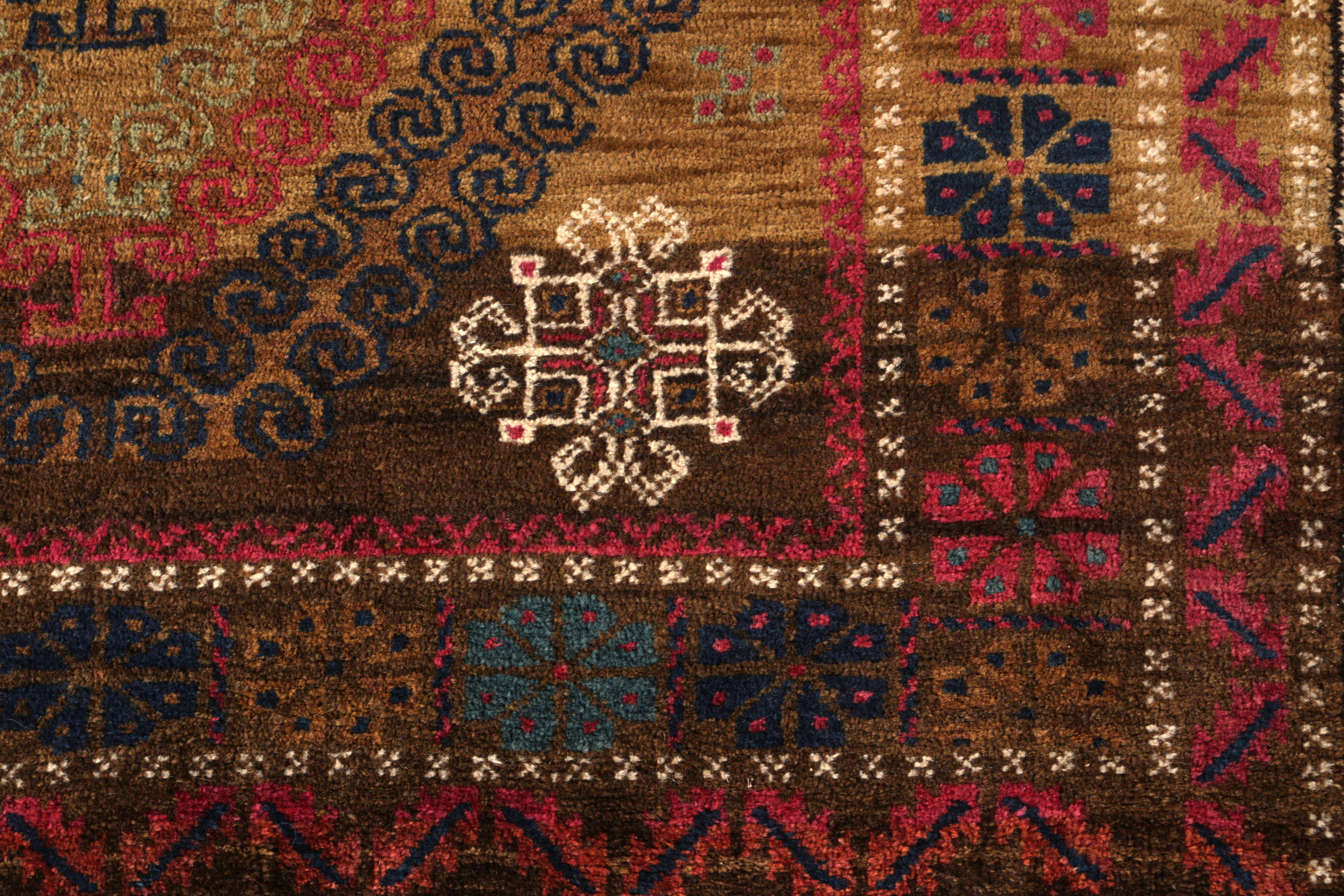 Hand knotted in wool originating circa 1950-1960, this vintage midcentury Persian rug enjoys both an astutely preserved quality wool and one of the most uniquely intricate plays of geometry through color among this collection of vintage Baluch rug