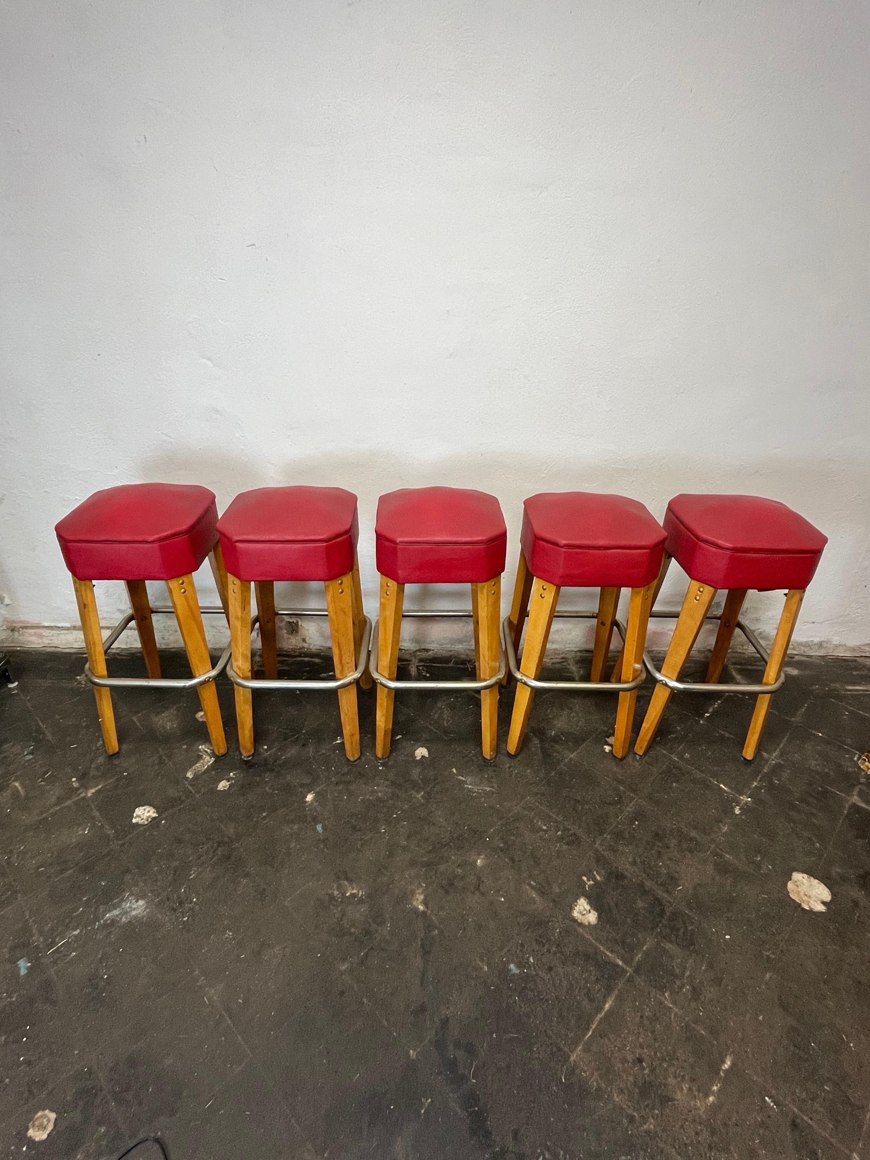 Stunning survivors! Heyward Industries bar stools with tapered knife legs, textured naugahyde seats and steel foot rails. Great period lines, solid and sturdy. 
Curbside to NYC/Philly $450