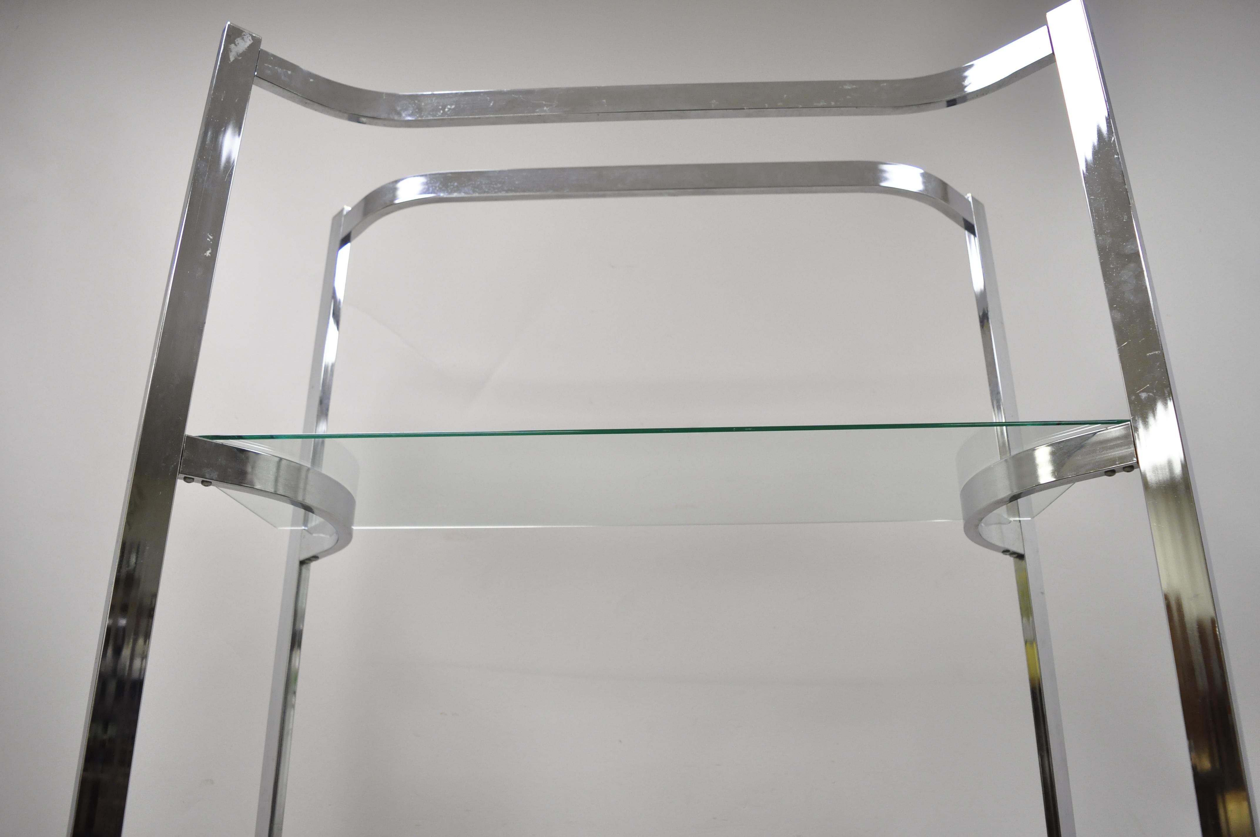 glass and chrome bookcases
