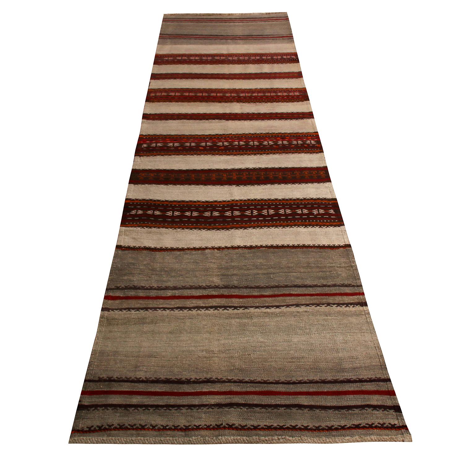 Handwoven in wool originating from Persia between 1950-1960, this vintage midcentury Persian Kilim runner is identified as a Kalat (Qalat) rug, named for the titular region and the nomadic tribal weavers of this family of Turkeman (Turkoman) rug