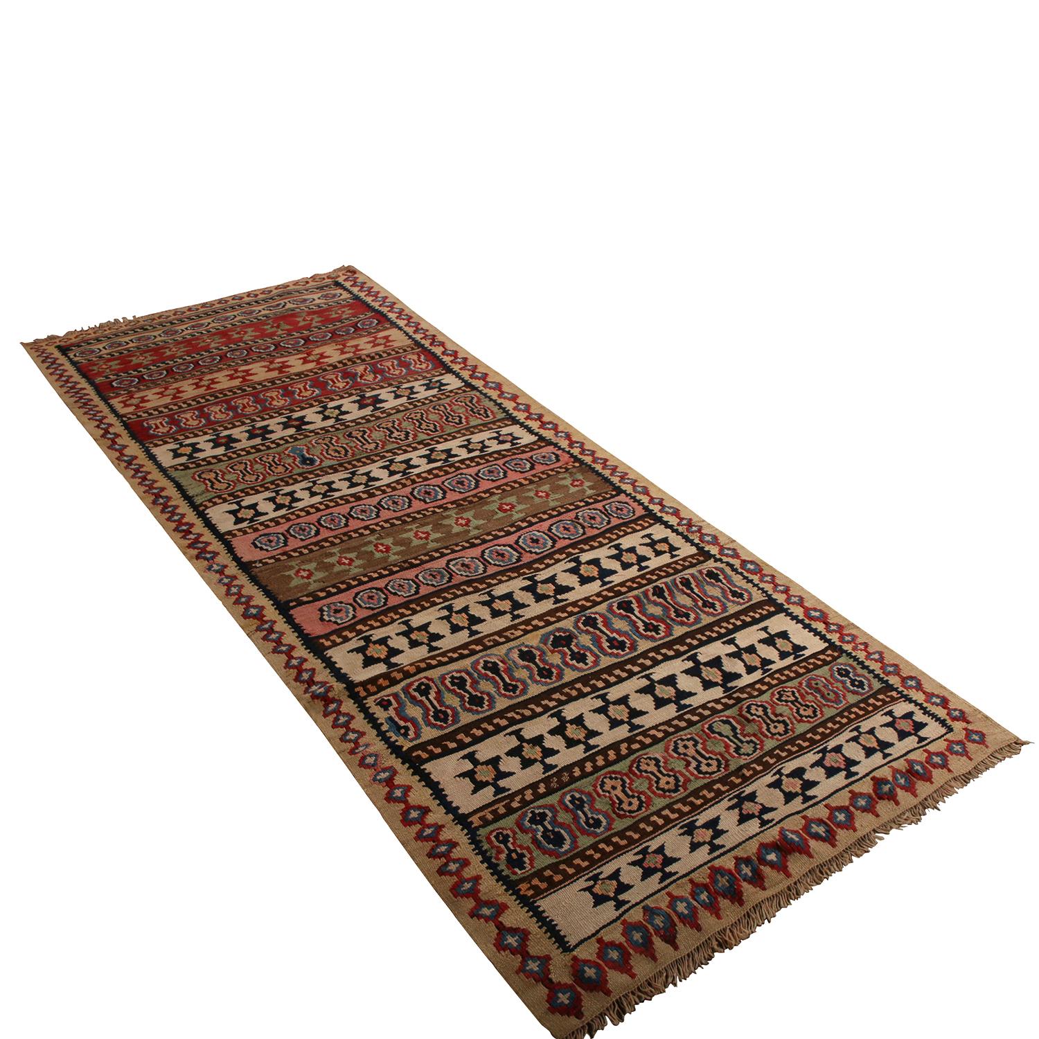 Handwoven in wool originating between 1950-1960, this vintage midcentury Persian Kilim hails from the Bidjar (Bijar) region, known for exceptionally durable and sought-after pieces among tribal rarities. The emphasis of highlights and accenting