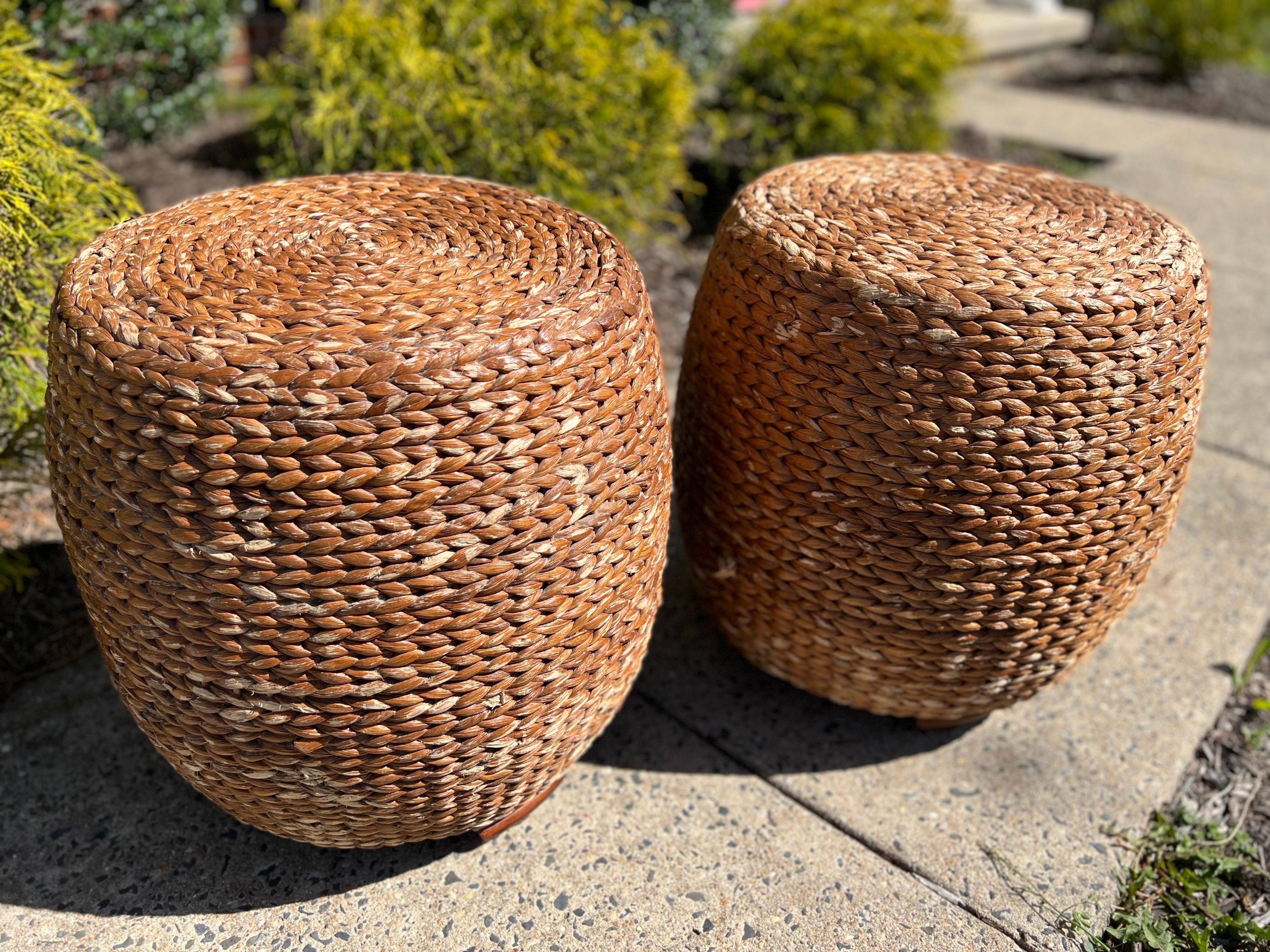 Versatile vintage braided rope stools or side tables with stacked wooden feet. Supported by a sturdy interior wood frame. These stools may serve many purposes and beautifully accent a variety of design styles. Perfect for adding warmth with natural