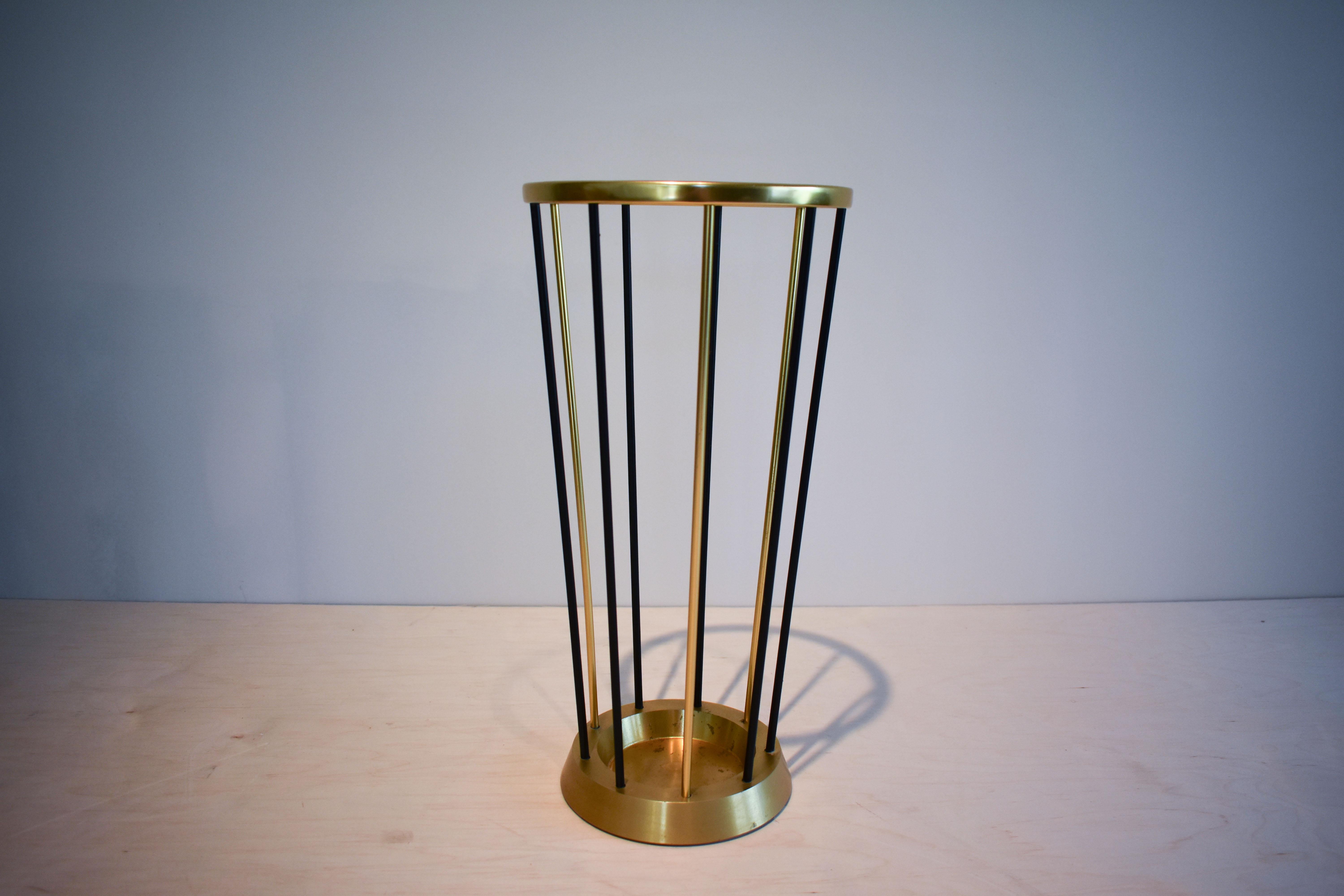 Some have said that this beautiful umbrella stand was made in 1950's or '60s Germany or Austria but it has no markings and we haven't found any credible evidence to support these claims. The brass plated top element is made of aluminium, the heavy