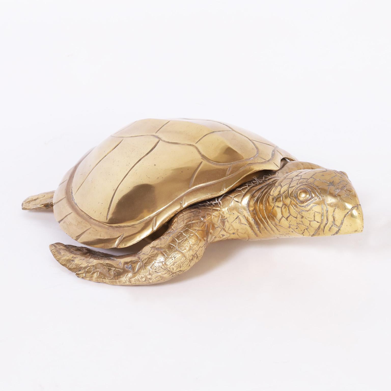 Life size sea turtle sculpture or object of art crafted in cast brass in a life like form with removable shell.