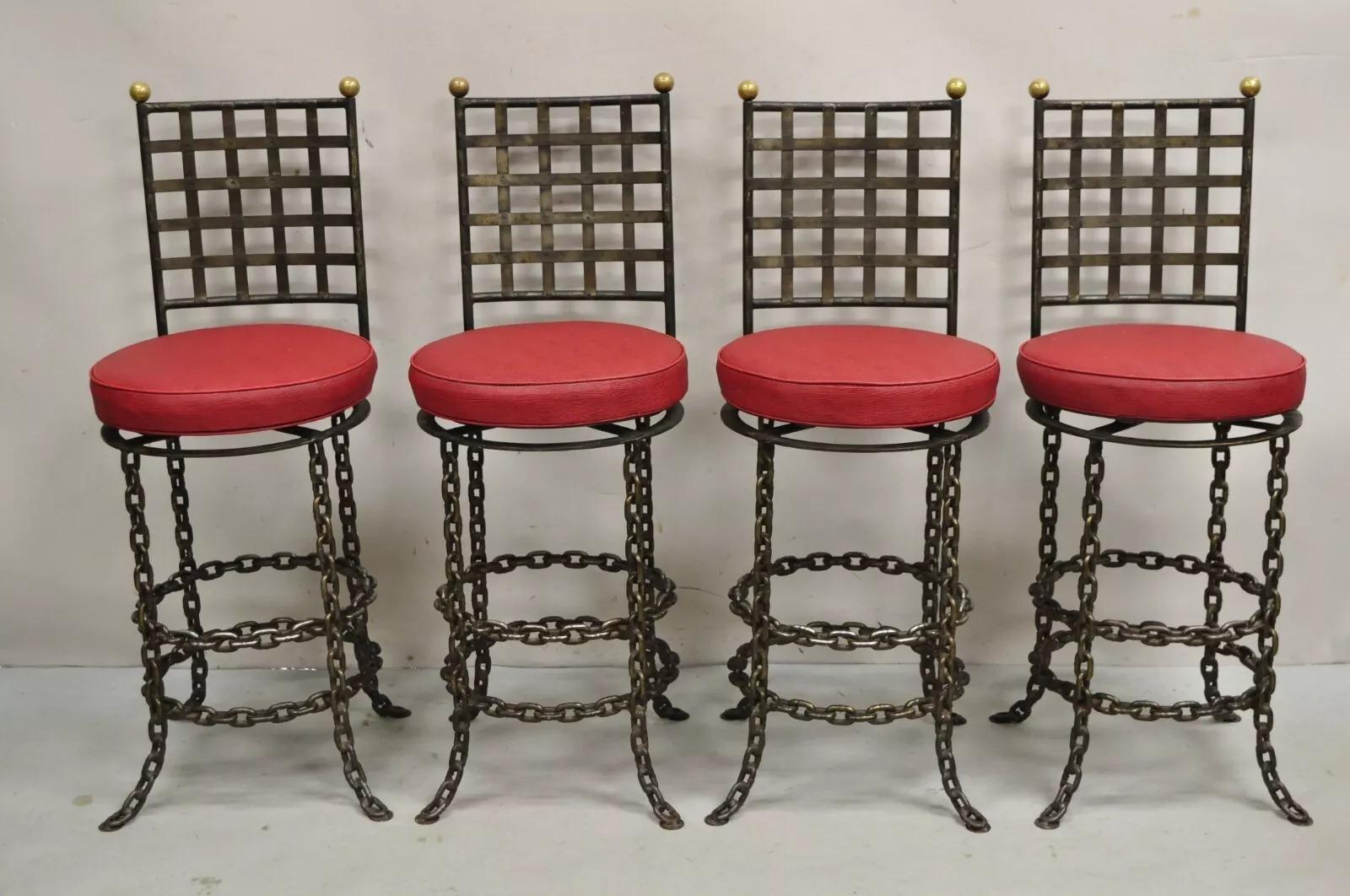 Vintage Mid Century Modern Brutalist Wrought Iron Chain Link Swivel Counter Bar Stools - Set of 4. Item features heavy iron frames, swivel seats with backrests, brass ball finials, removable back cushions, attractive distressed finish. Listing