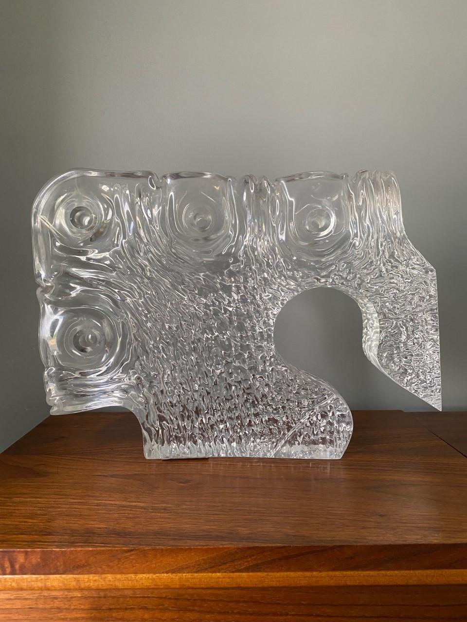 A sculptural interpretation of an organic shape that is enigmatic, poised and unpredictable. A study in form, this vintage lucite piece dates to the early 1960s. In essence it is minimal and clean but conjures with a brutalist presence. Ondulations,