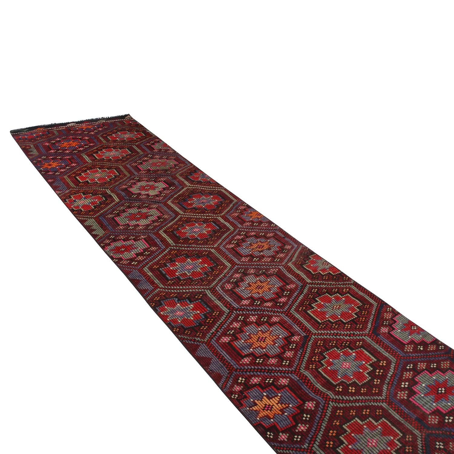 handwoven in Turkey originating between 1950-1960, this vintage mid-century wool Kilim runner enjoys a meticulous play of embroidery and flat weaving, uncommon and distinguishing of a select line from our recent additions to our collections. This