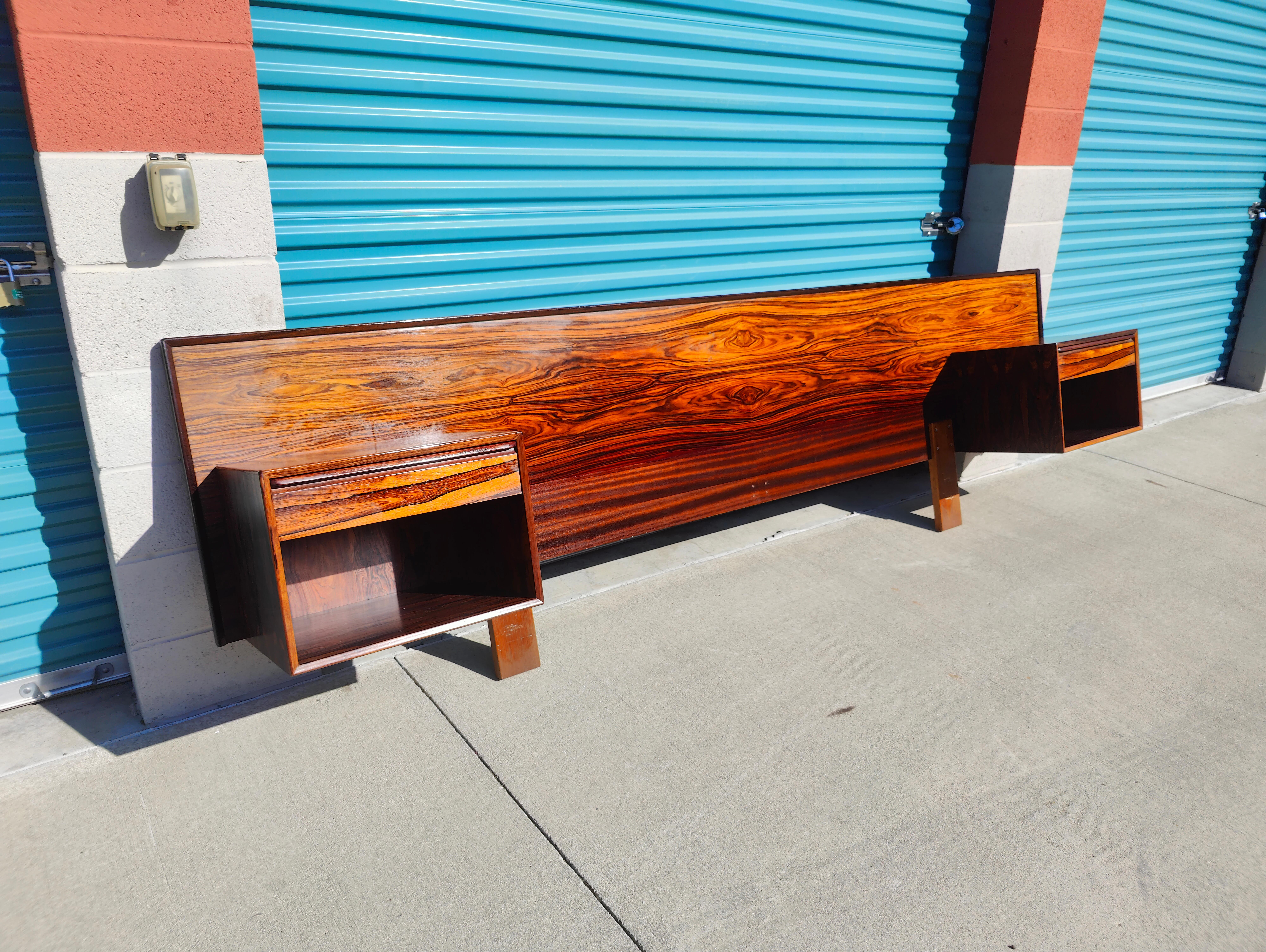 Now available is an amazing headboard by Westnofa. This beauty features a rosewood finish with floating nightstands attached by hardware. Not pictured but it includes a metal frame. Fits a Cal King mattress . Measures approximately 124 inches wide x