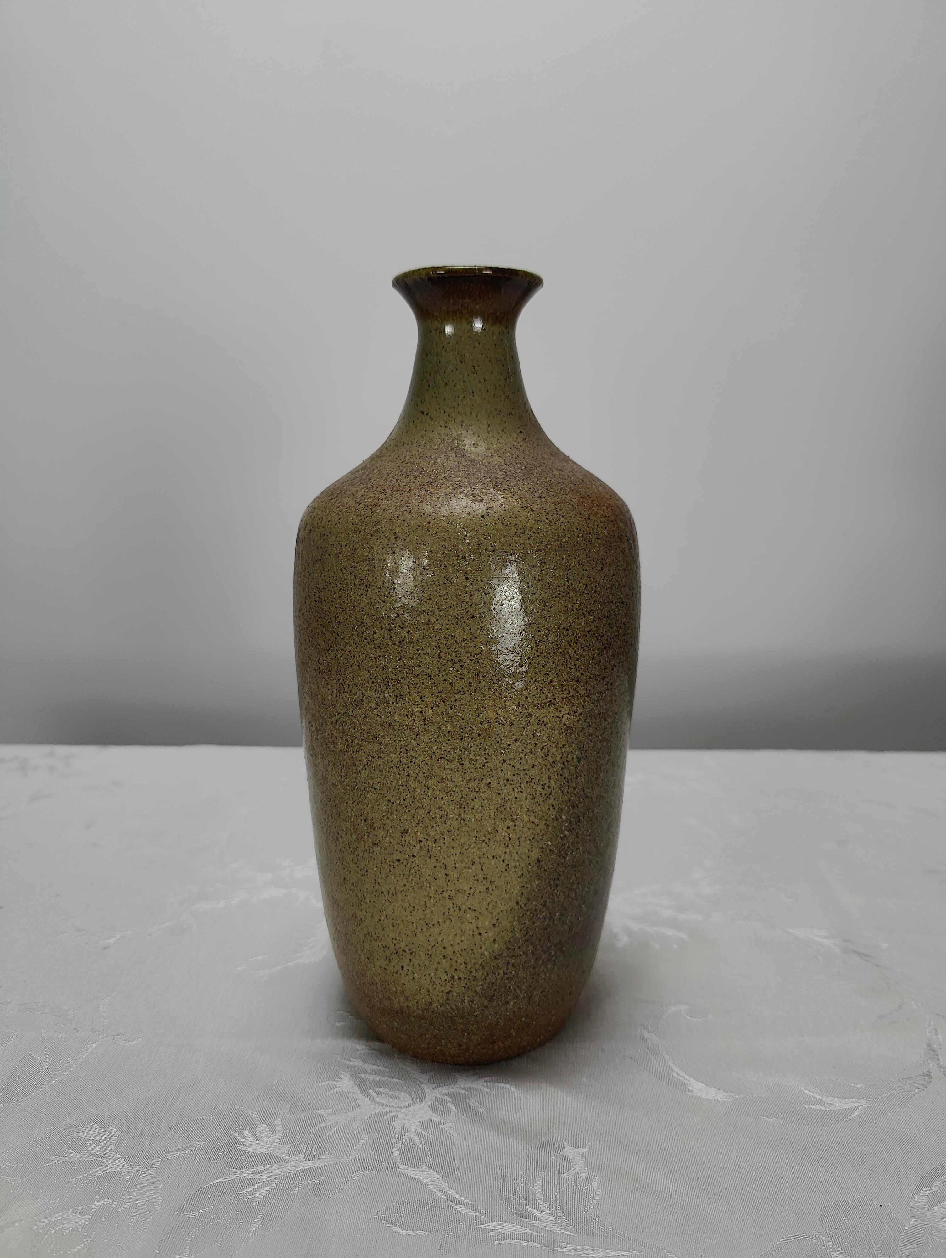 Great condition; measures approximately 10.5 inches tall x 5 inches at widest part. Perfect for any midcentury styled home. By ceramist, Maxine Scholts. If you have any questions, please feel free to reach out.