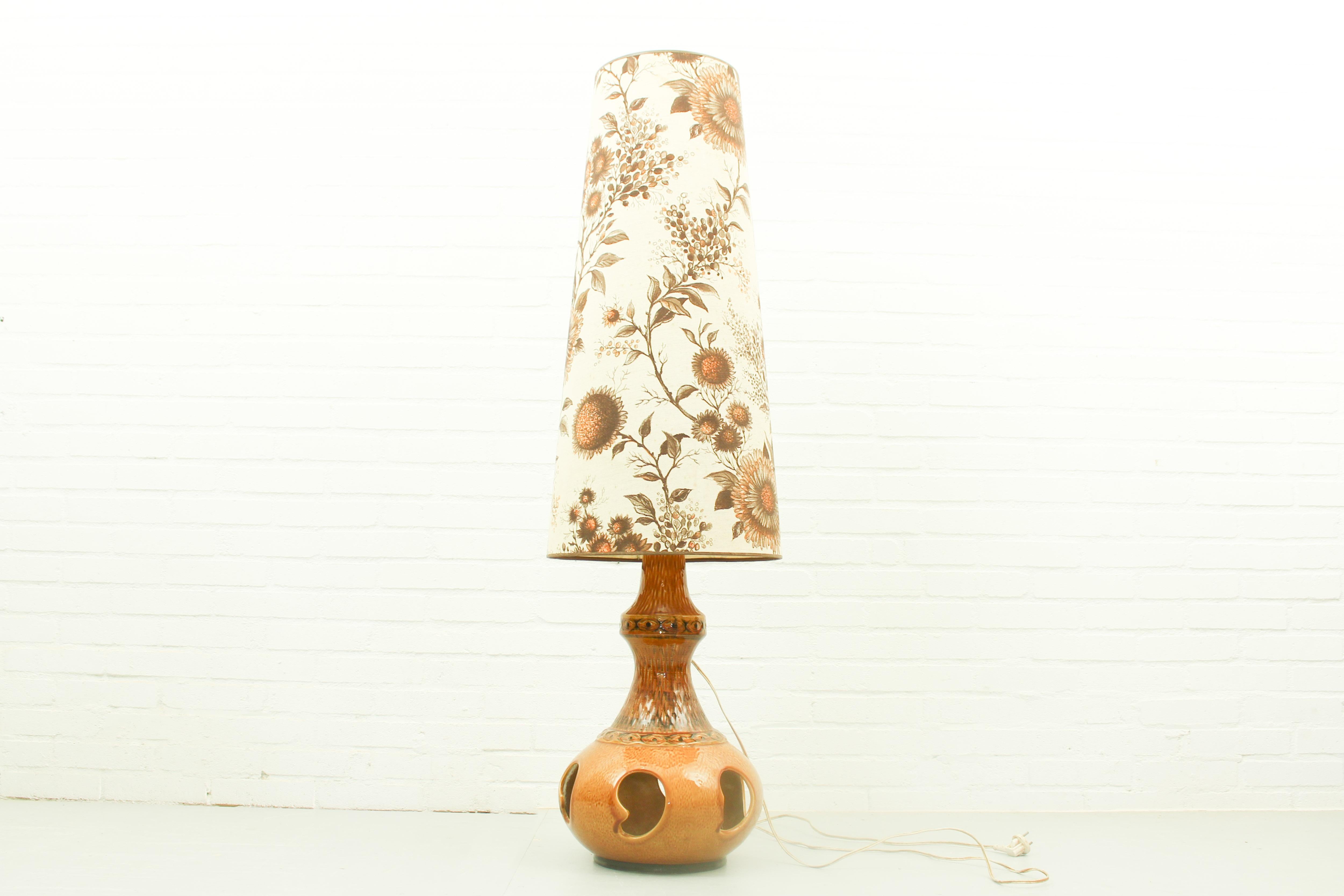 Scheurich style ceramic fat lava floor lamp. The original shade is completely intact, although it does have some stains. Dimensions: 129cm h, 38cm w, 38cm d.
