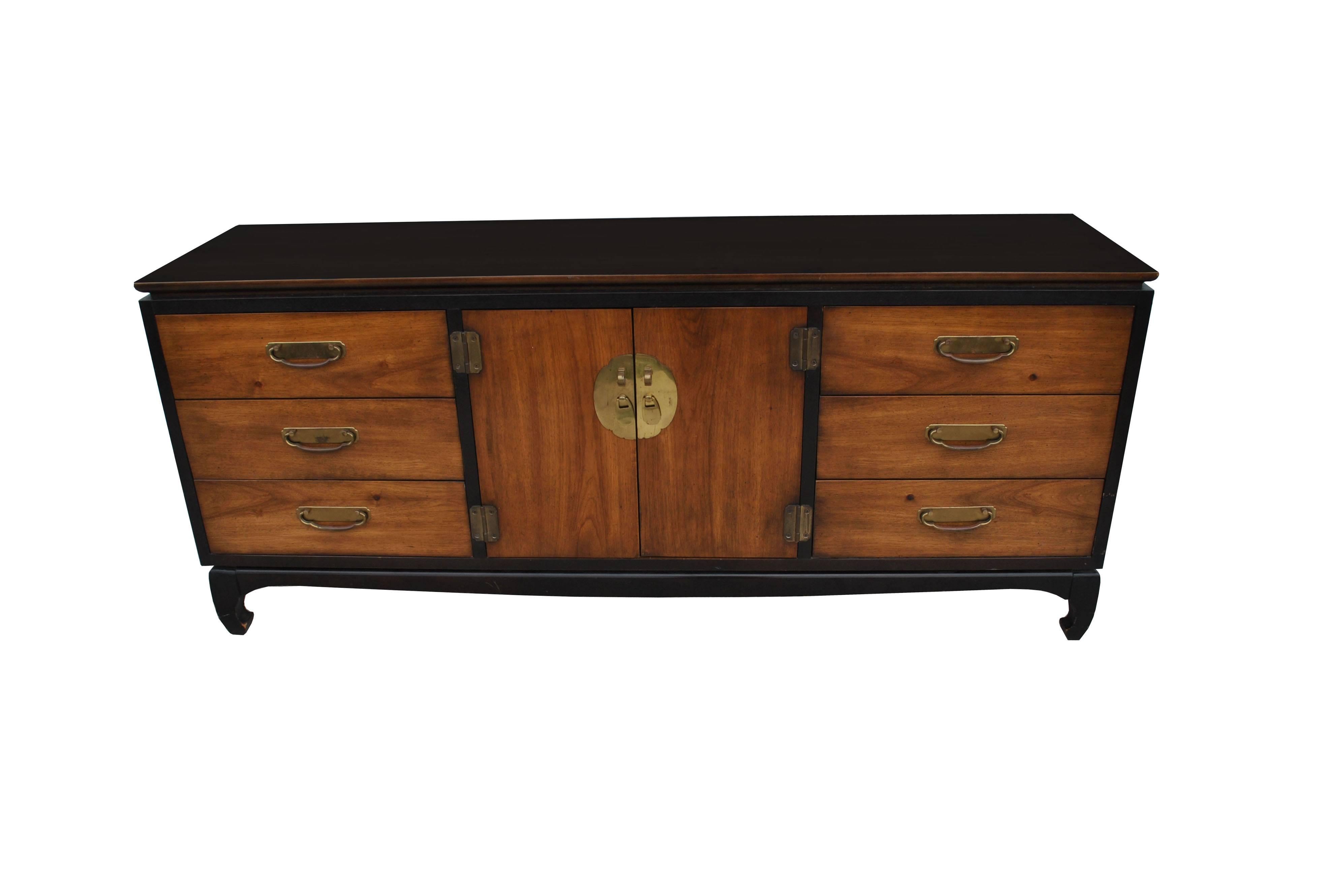 Chin Hua style nightstand by Lane Furniture. Featuring bronze motif hardware. Ebonized sides and top featuring a two-door cabinet with ample storage. 

 