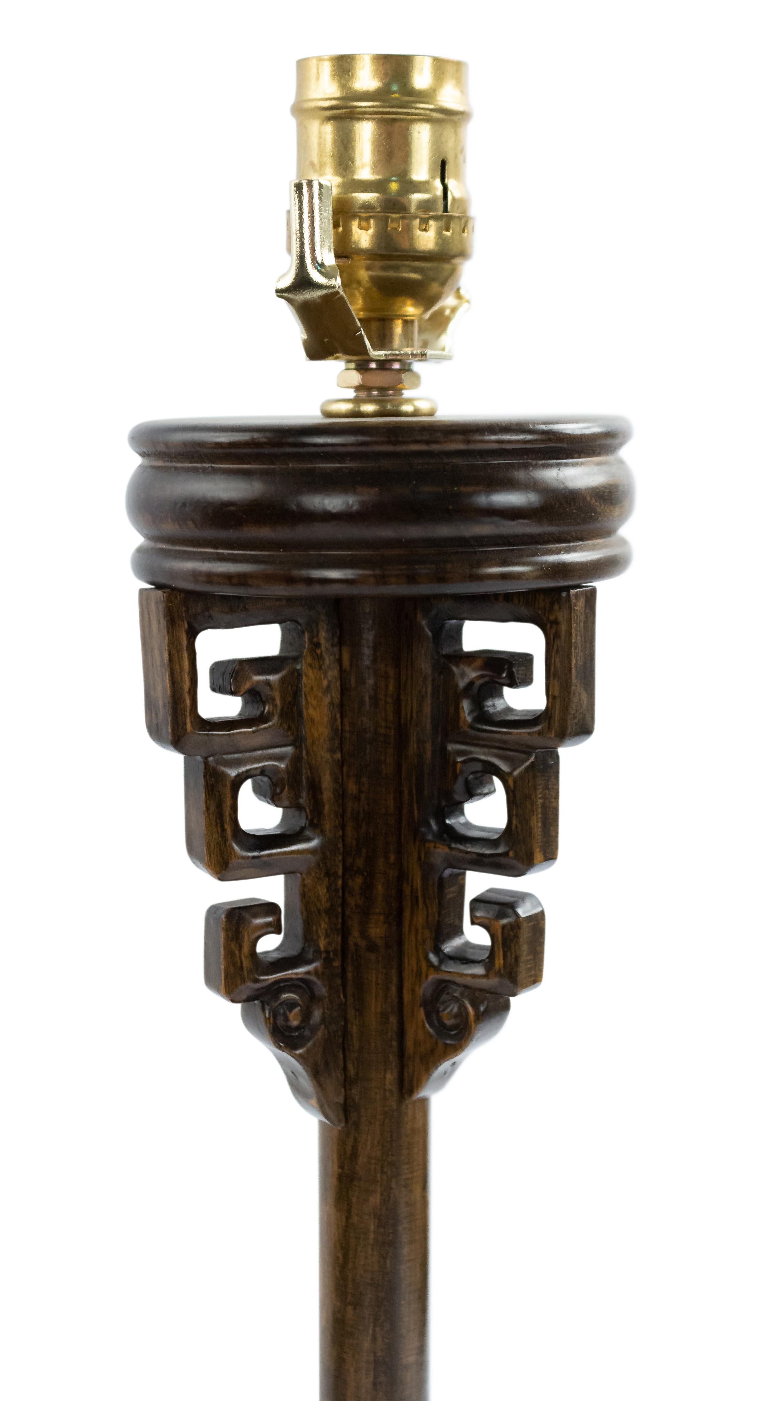 Vintage mid-century Chinese style wood lamp with fretwork design carving.