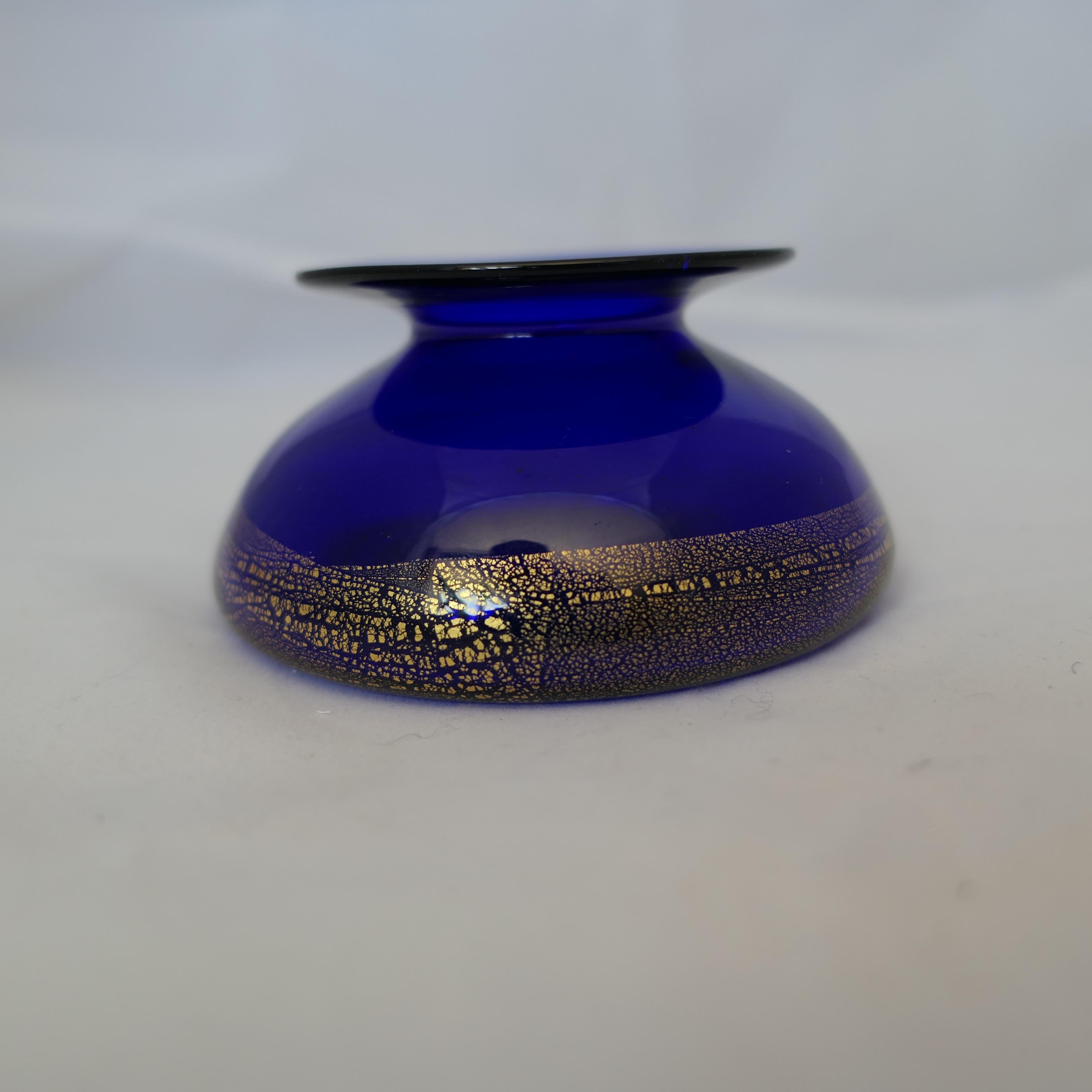 Vintage Mid Century Cobalt and Gold Leaf Dish, signed 


A nice piece for the collector, in Very good Condition measuring approximately 2” in height and 4” in diameter 

FB219