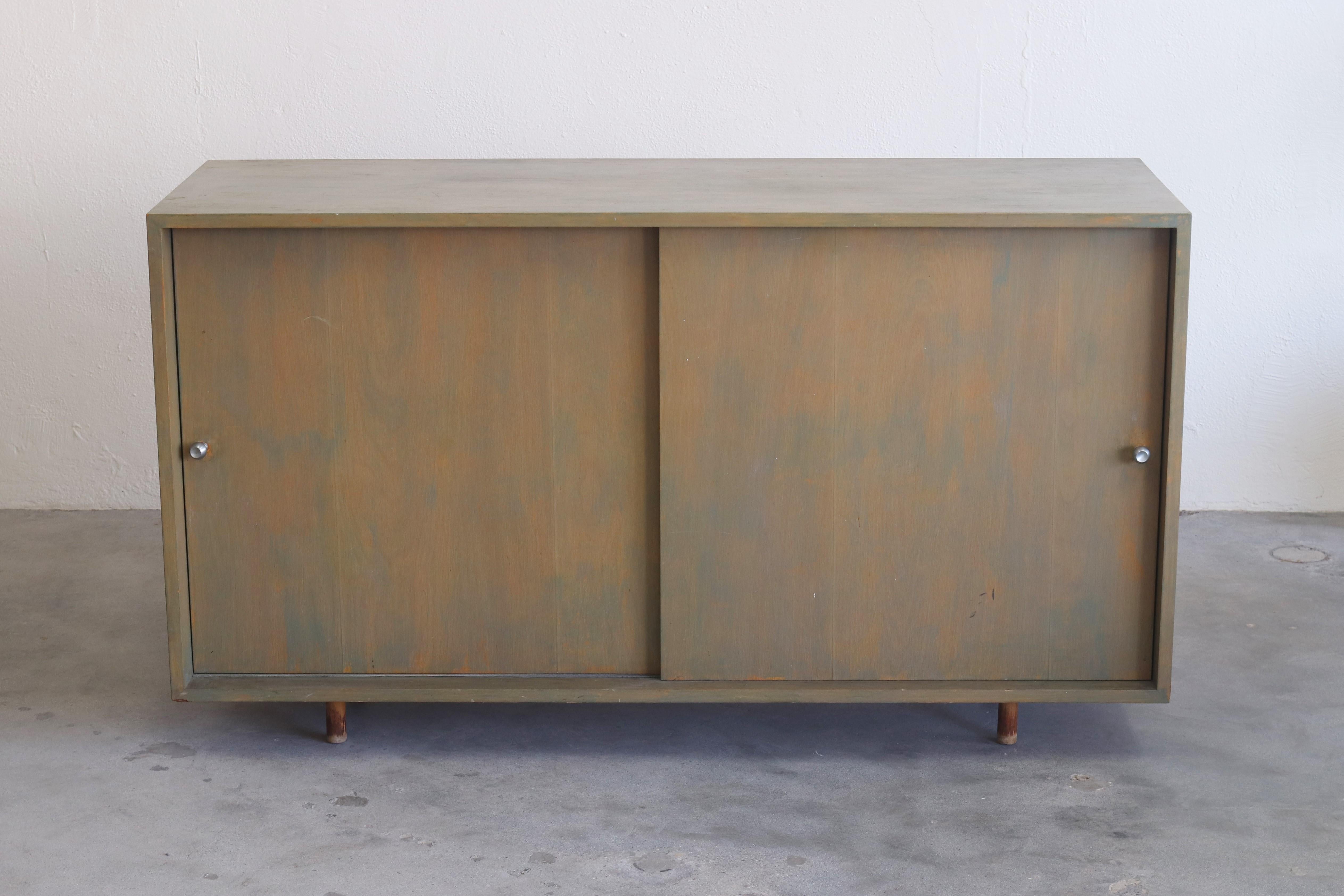 Here is a rare opportunity to own a custom piece of furniture by the celebrated designer, Alvin Lustig. As seen in the photos, there is a moderate amount of wear to the item. However it presents very well and can provide lots of (book) storage!