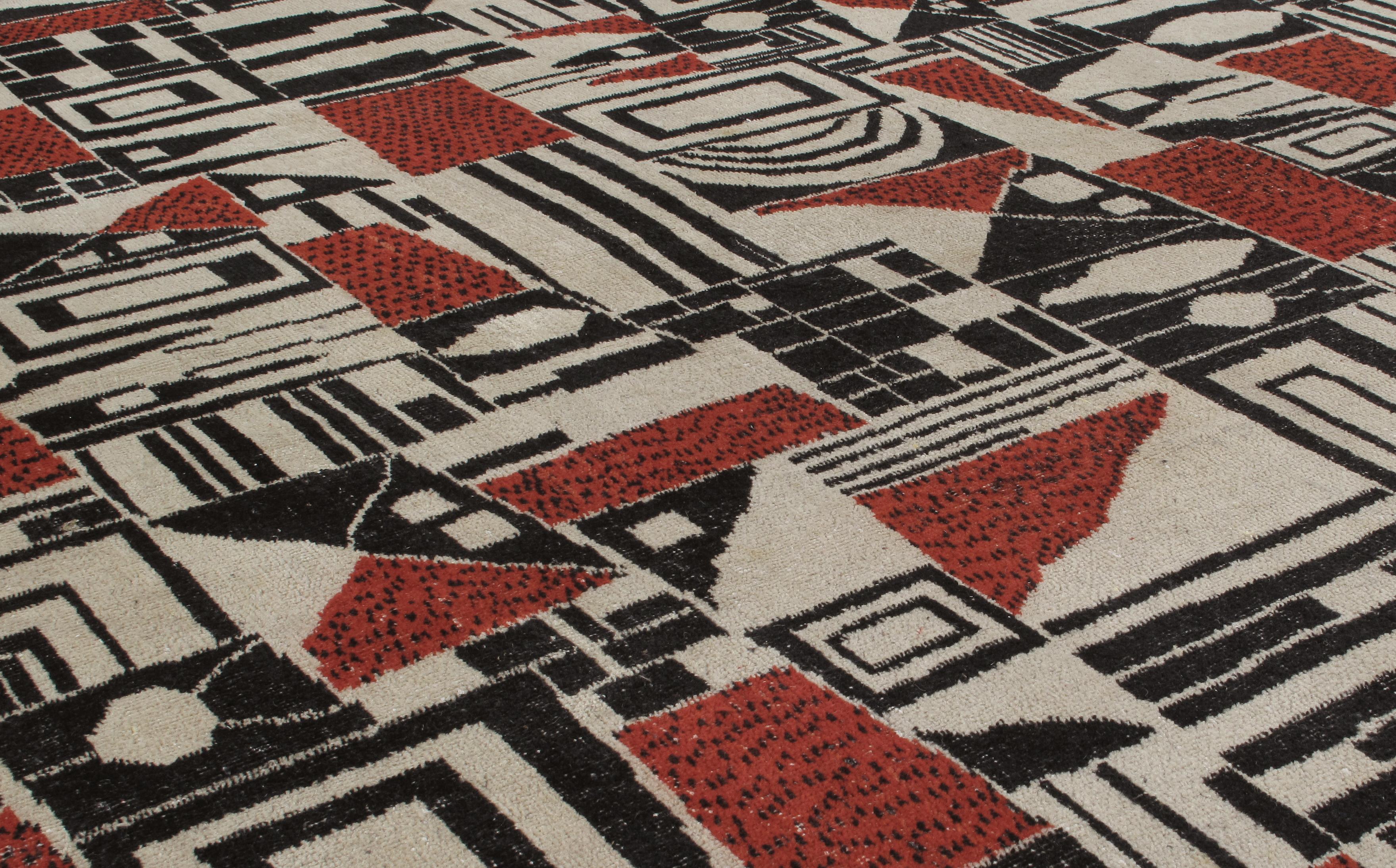 This vintage cubist rug was handmade in Turkey circa mid-20th century. It is in the style of Zeki Muren, a multidisciplinary Turkish artist, known for his bold, geometric, and whimsical designs. The harmonious pairing of color and pattern evokes a