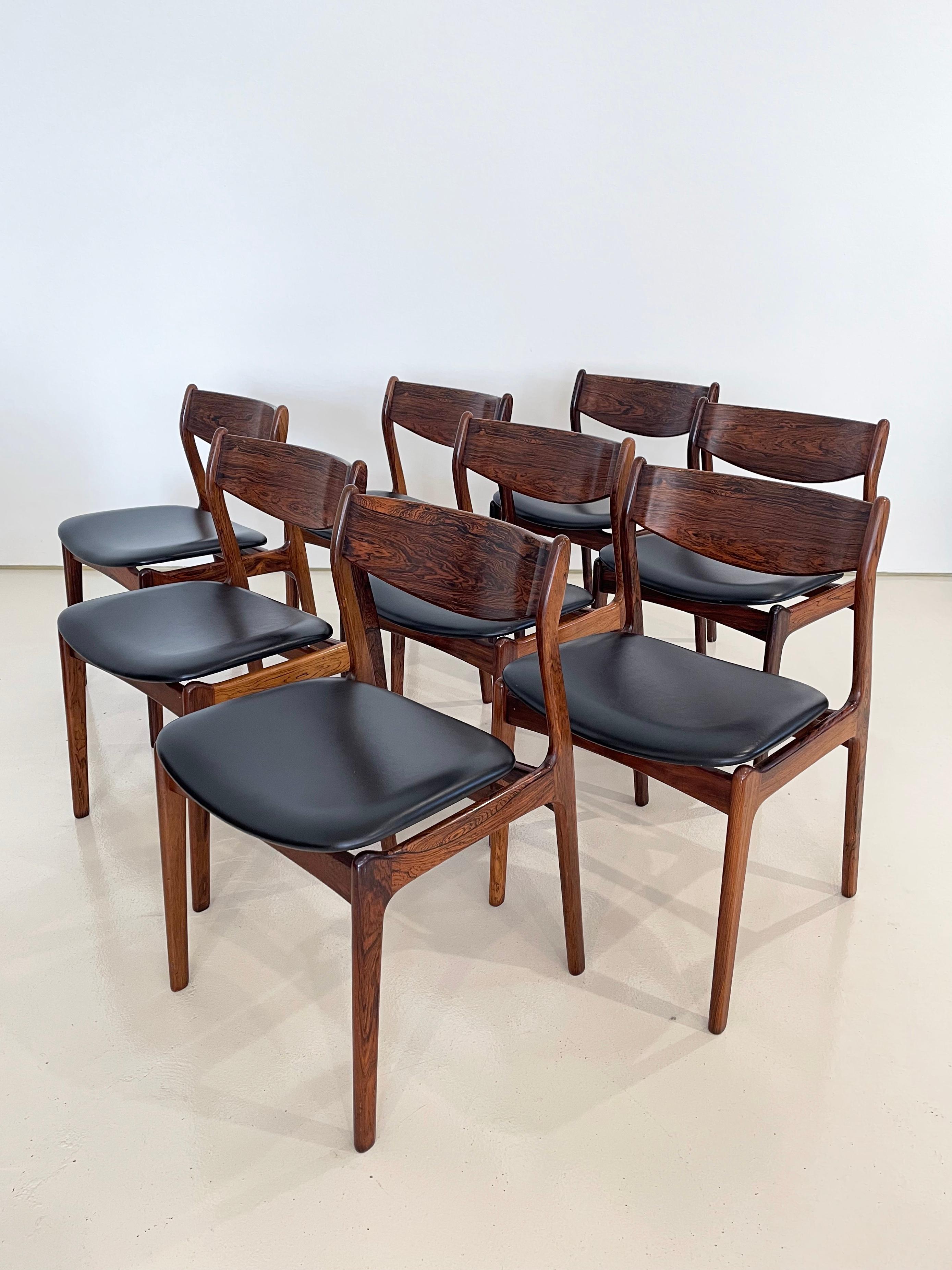 Manufactured in the 1950s by Farso Stolefarik in Denmark

Designed by P.E. Jorgensen

Set of 8.

Each chair is crafted of Brazilian rosewood with dark figured grains

Upholstered seats and backs are believed to be original and in near mint