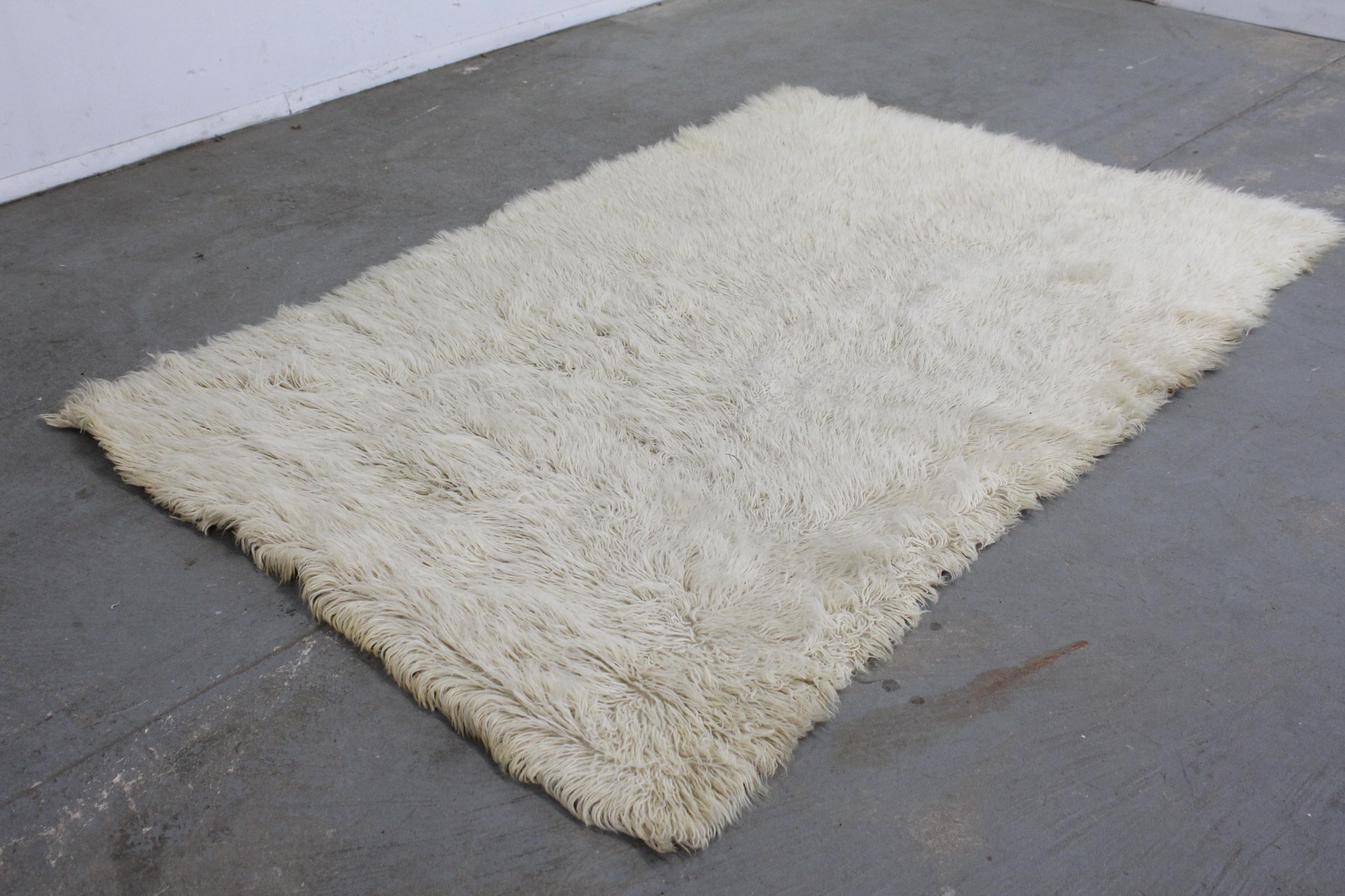 Mid-Century Modern style abstract shag rug.

Offered is a vintage mid century Danish modern off white wool shag 56